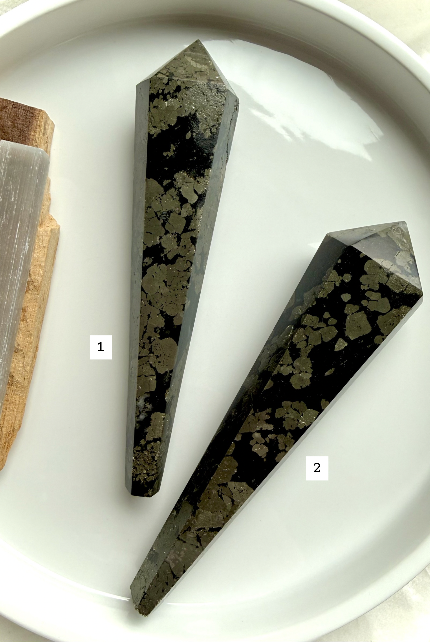 pyrite wand in black matrix two polished crystal points labeled for selection
