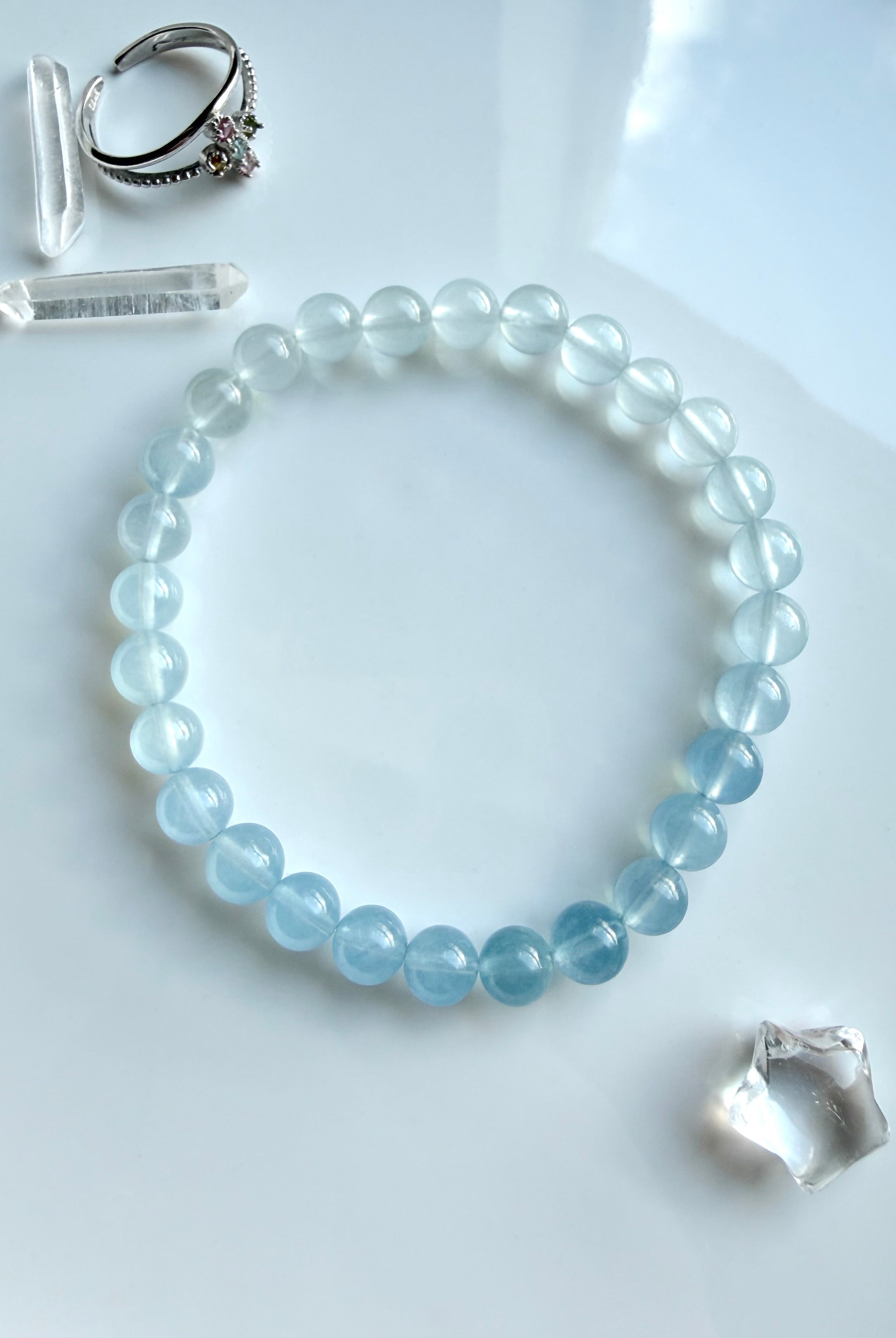 Close-up of a single Aquamarine crystal bracelet in luminous blue ombré – March birthstone jewelry