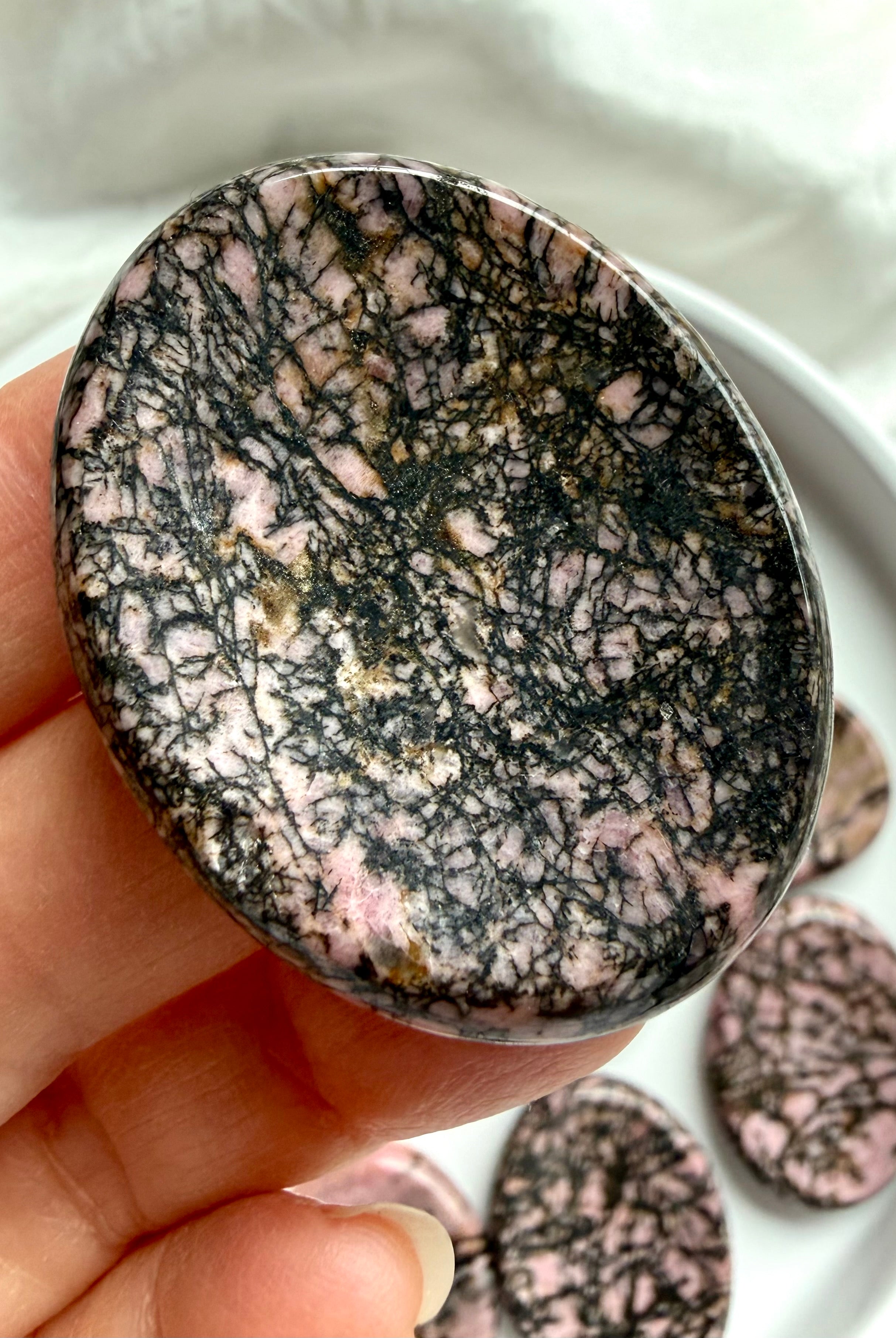 Rhodonite pocket crystal with dense black manganese inclusions