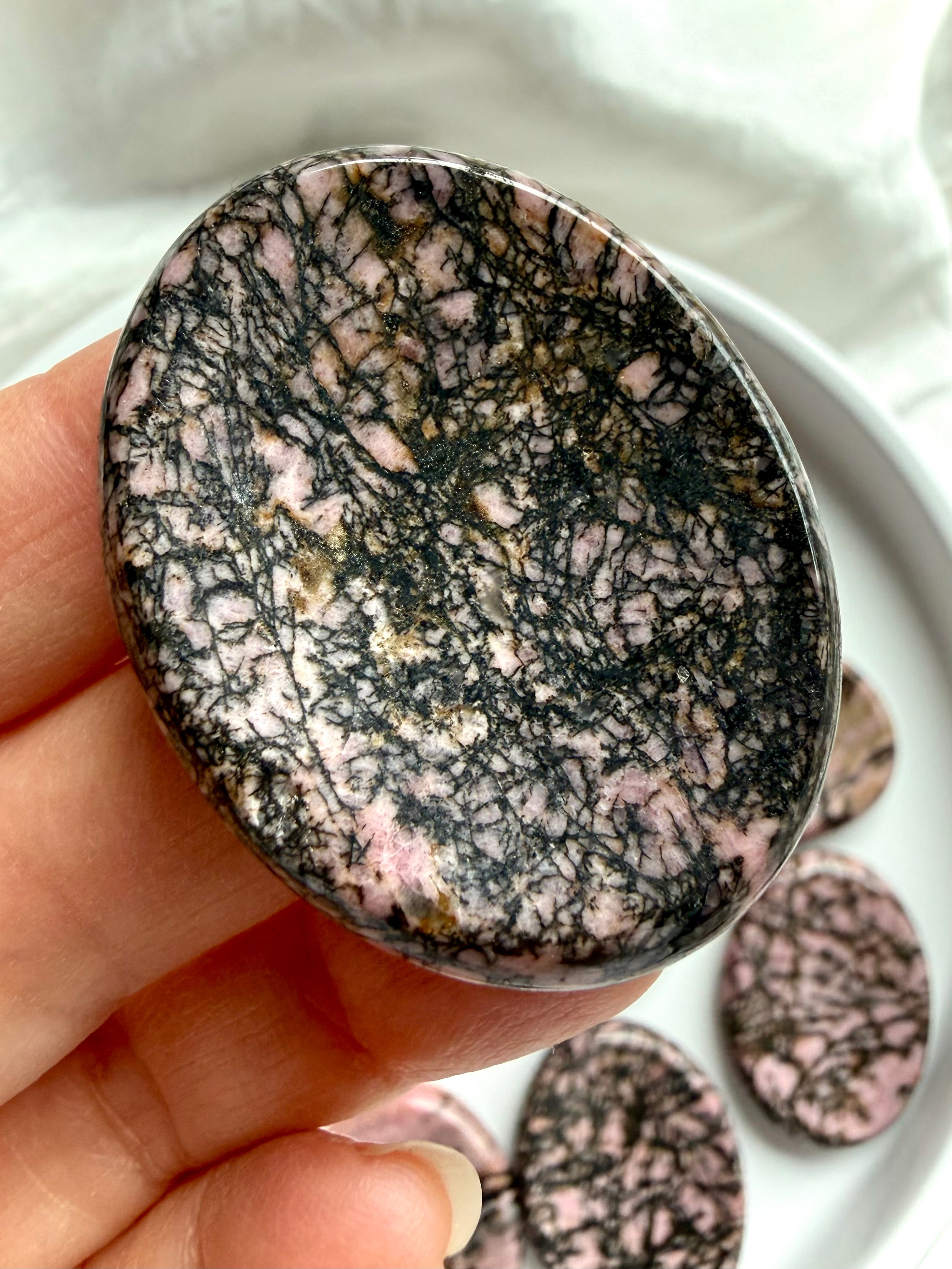 Rhodonite pocket crystal with dense black manganese inclusions
