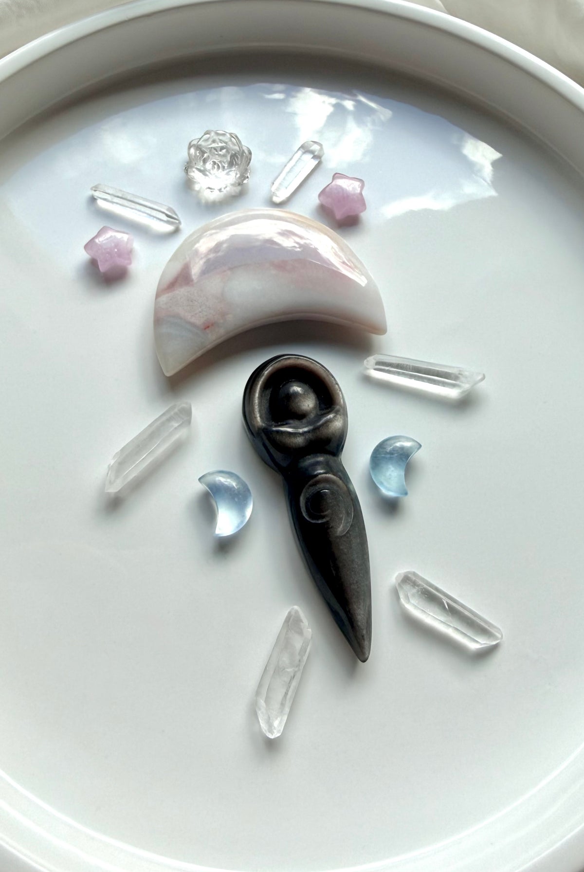 Crystal grid with Silver Sheen Obsidian goddess, Aquamarine moons, Kunzite stars and Clear Quartz points