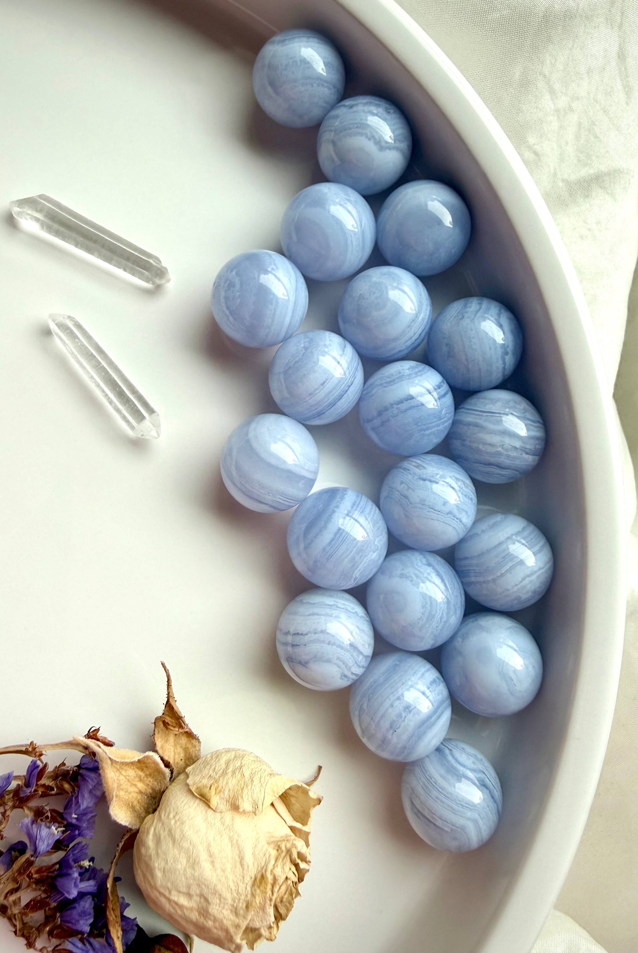 Soothing Blue Lace Agate spheres, a throat chakra crystal of clear, heart-centered communication.