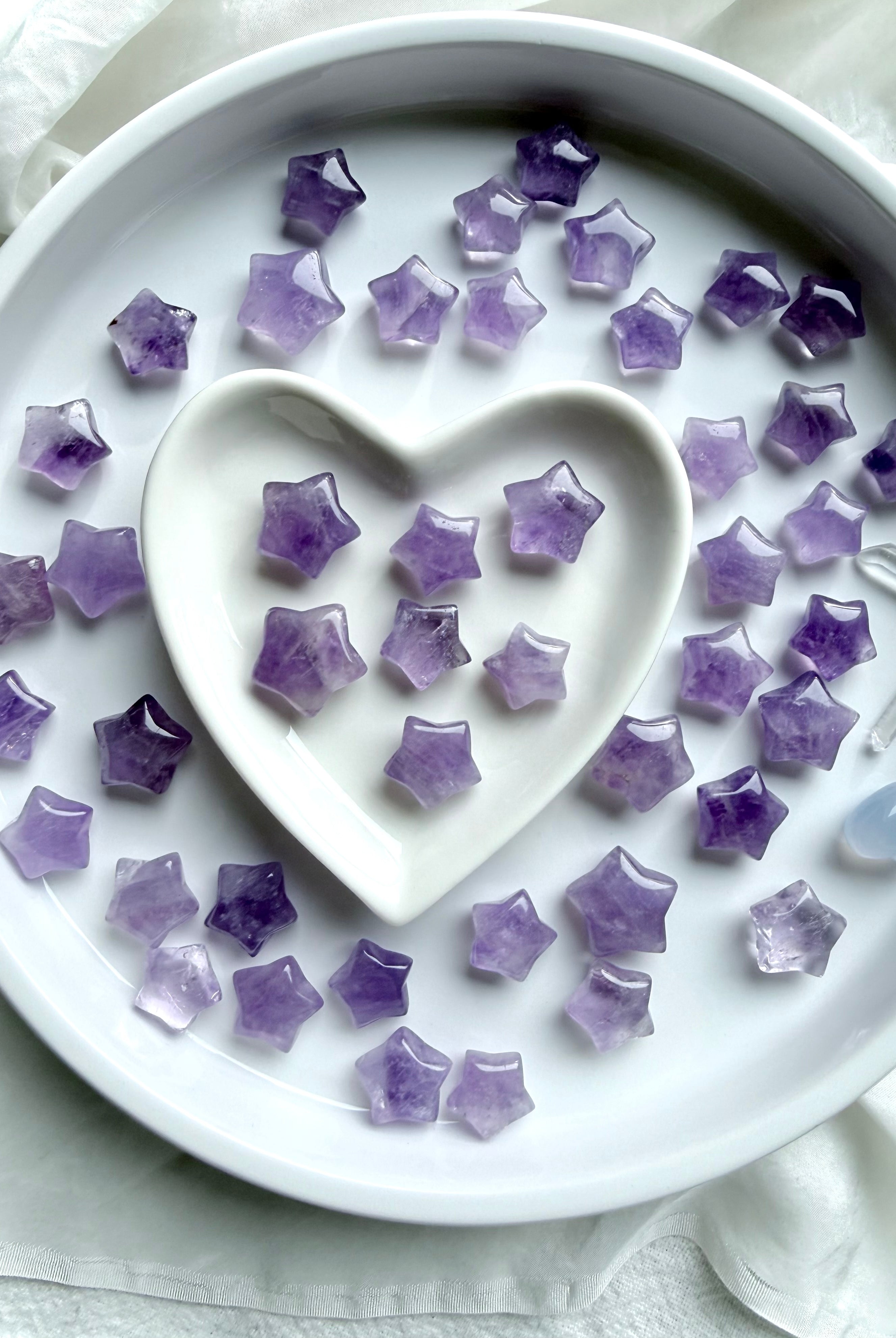 Mini Amethyst star carvings styled in a heart dish, peaceful crystal stars for meditation, rituals, and sacred gifting