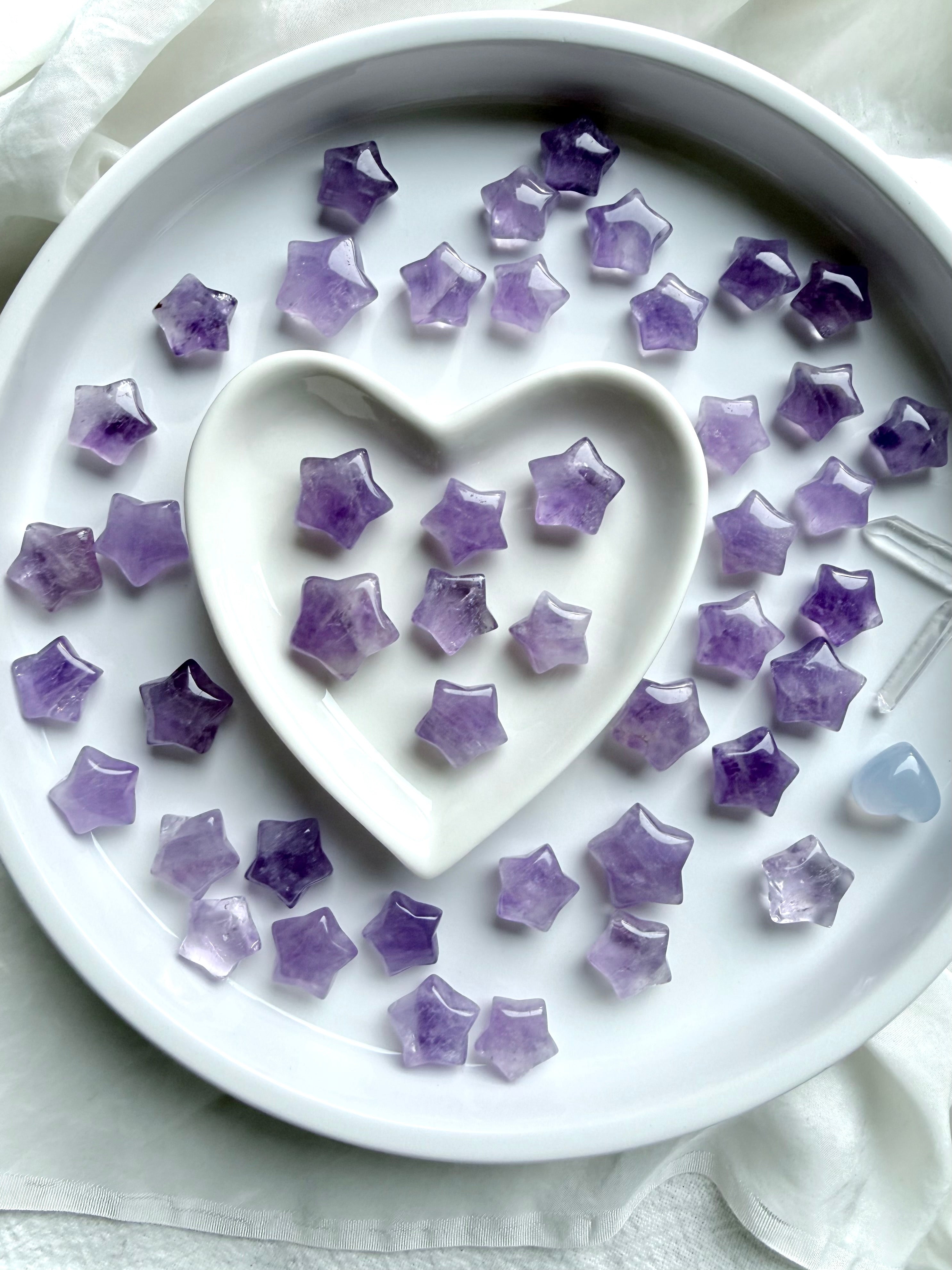 Mini Amethyst star carvings styled in a heart dish, peaceful crystal stars for meditation, rituals, and sacred gifting