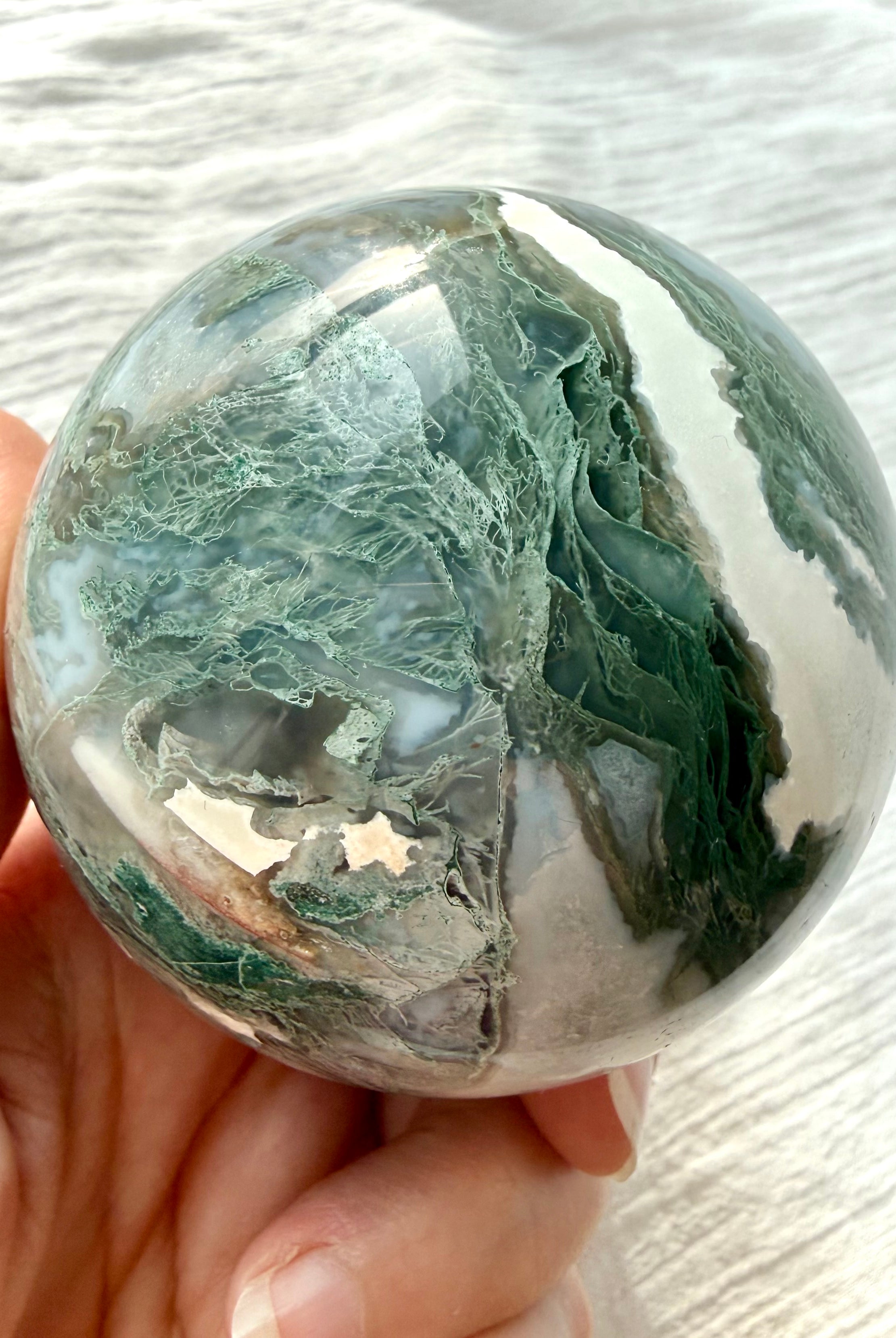 Moss Agate sphere with lacy green moss inclusions, white agate and natural Quartz formations