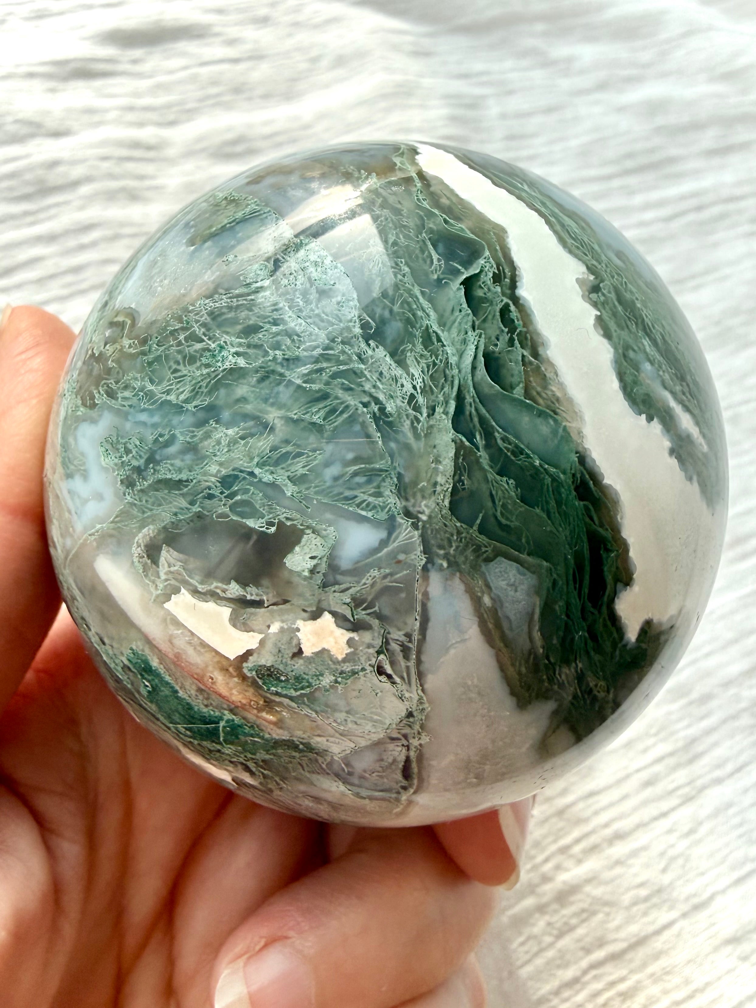 Moss Agate sphere with lacy green moss inclusions, white agate and natural Quartz formations