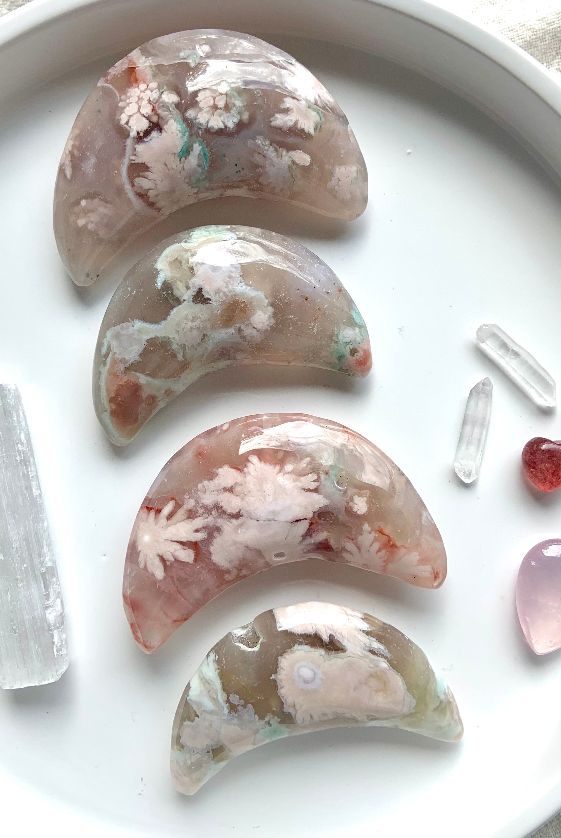Pick your favorite! These Hand Carved Flower Agate Crescent Moons are one of a kind with gorgeous colors + patterns