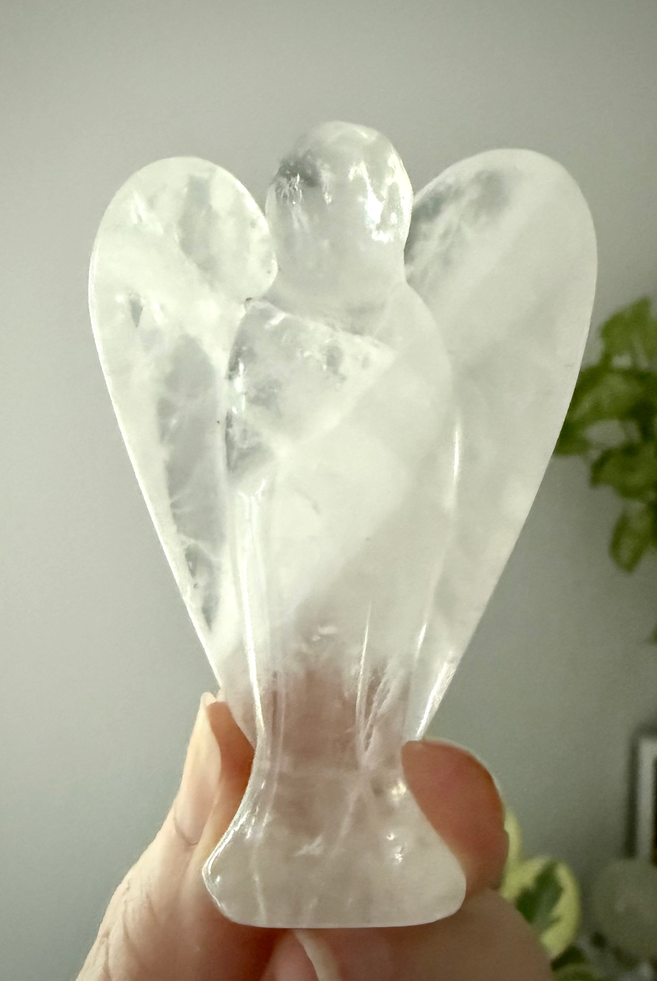 This Clear Quartz Crystal Angel Figurine easily fits in with any style of decor or color scheme