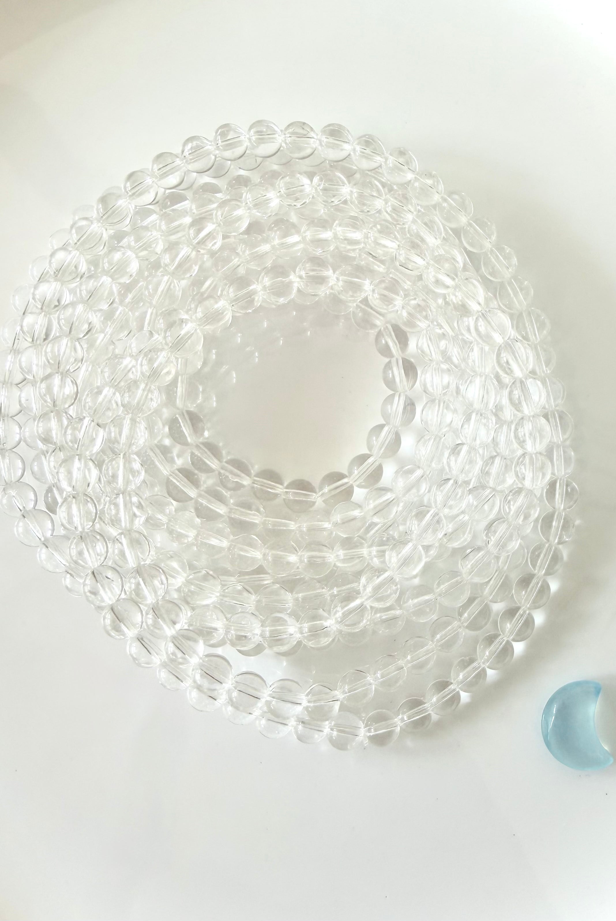 Coiled Clear Quartz bracelet displaying transparent crystal beads with exceptional natural clarity