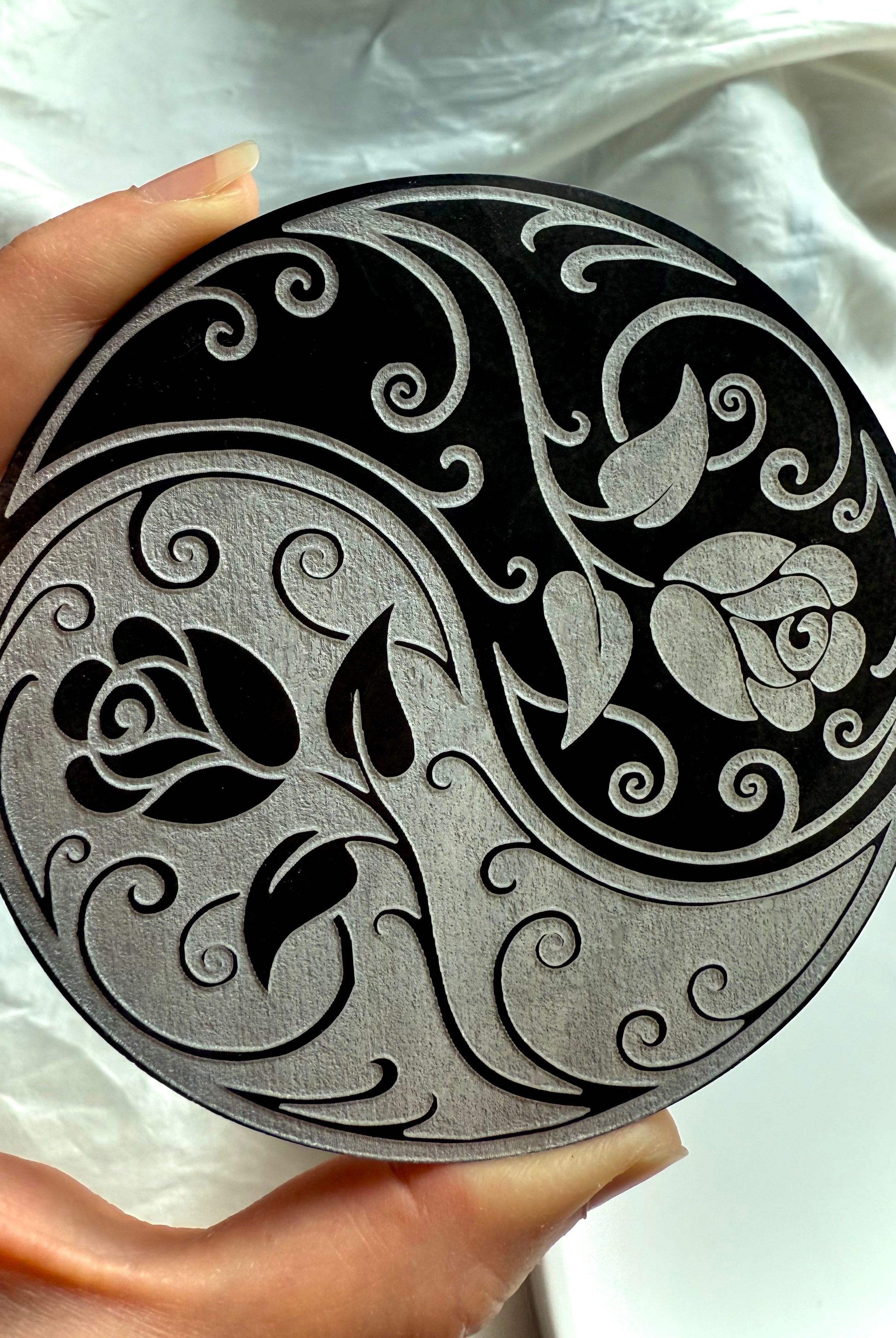Carved rose and swirl pattern on yin yang selenite charging plate for crystal grids and energy work