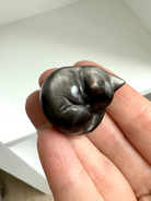 Silver Sheen Obsidian Sleeping Cat Carvings offer energetic protection to your sacred space.