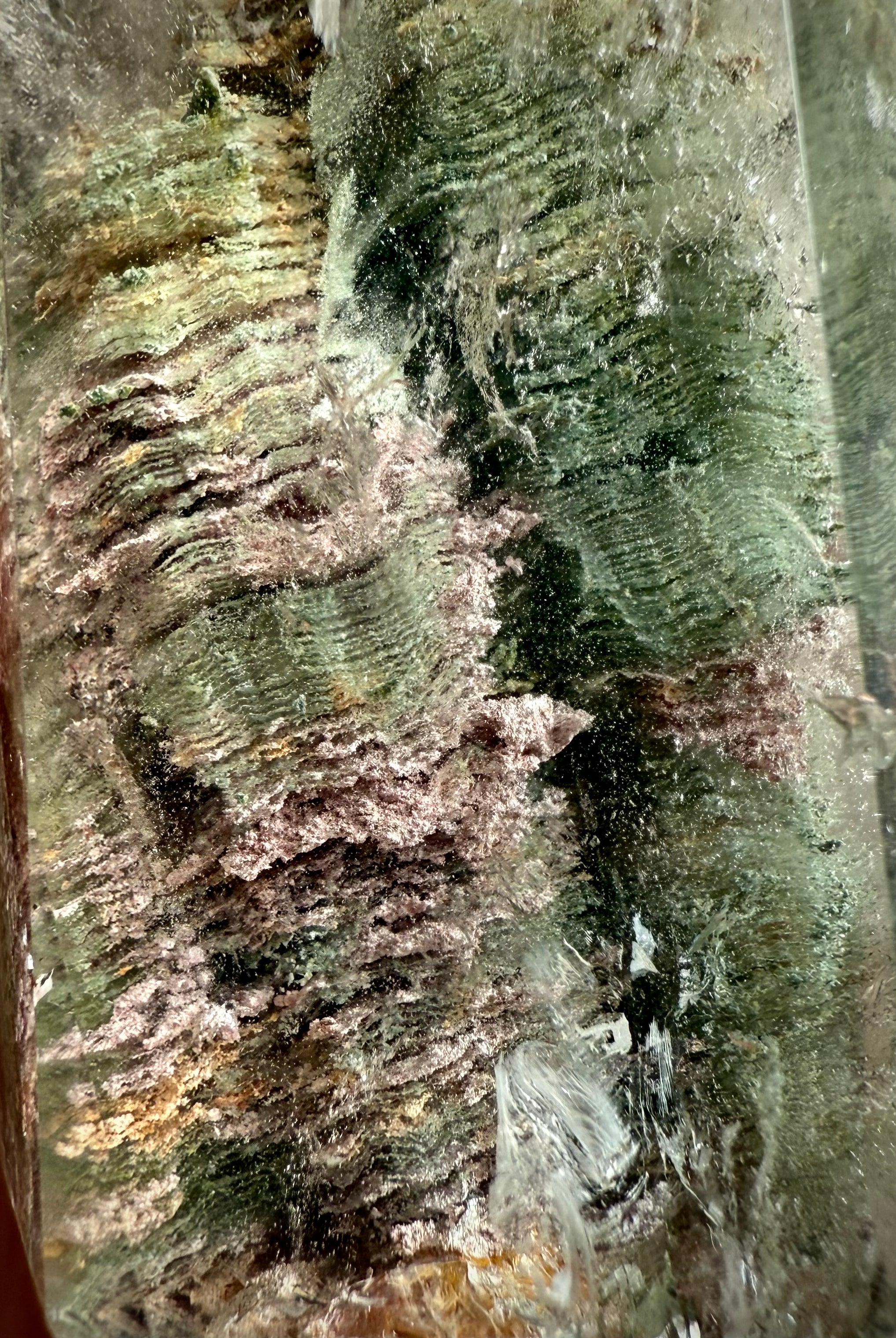Macro view of Thousand Layer Garden Quartz showing ancient growth lines & earthy mineral inclusions