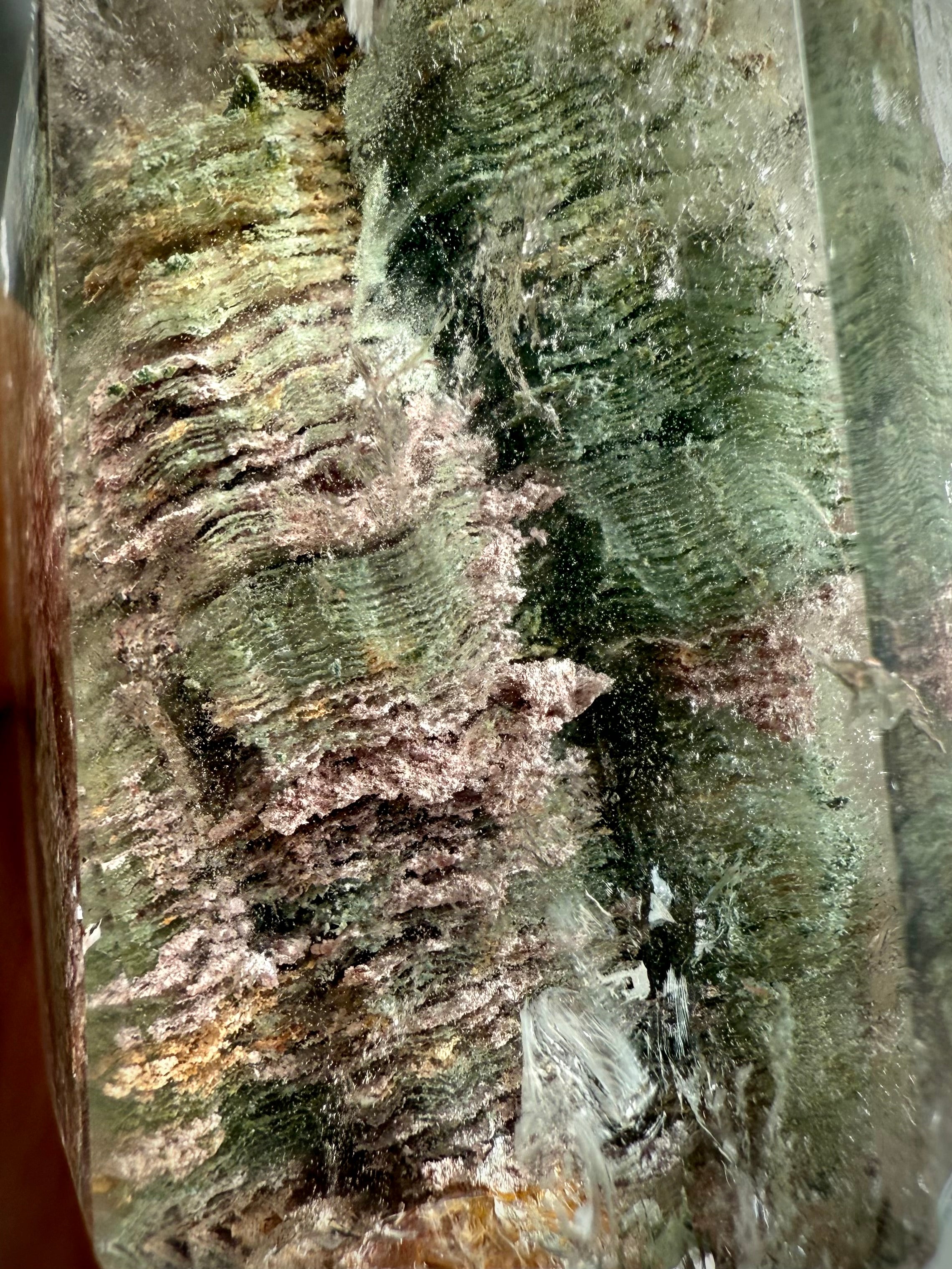 Macro view of Thousand Layer Garden Quartz showing ancient growth lines & earthy mineral inclusions