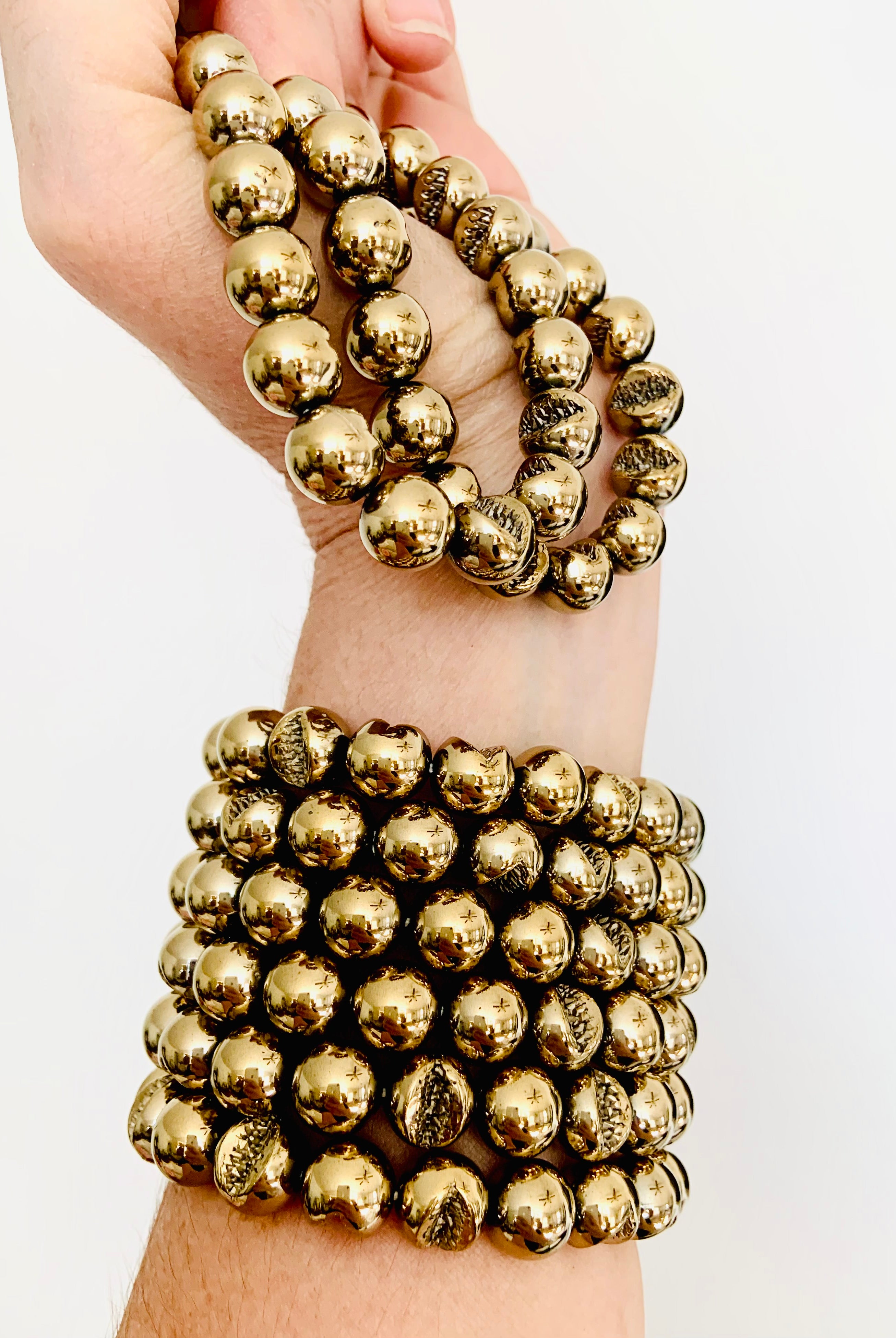 Stacked Pyrite bead bracelets on wrist: empowering crystal for success, willpower & energetic protection