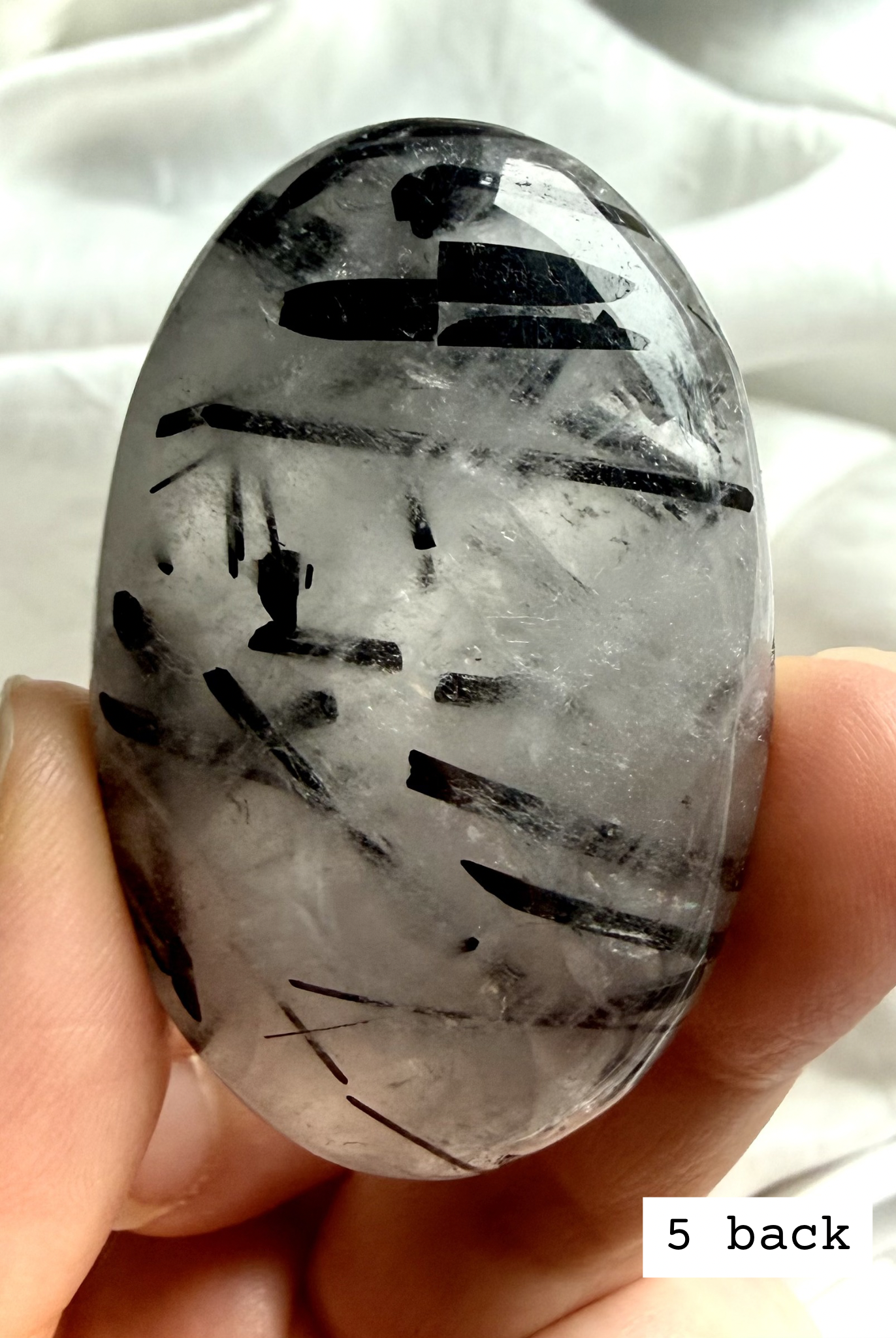 Black Tourmaline in Quartz palm stone 5 back view black tourmaline inclusions in clear quartz