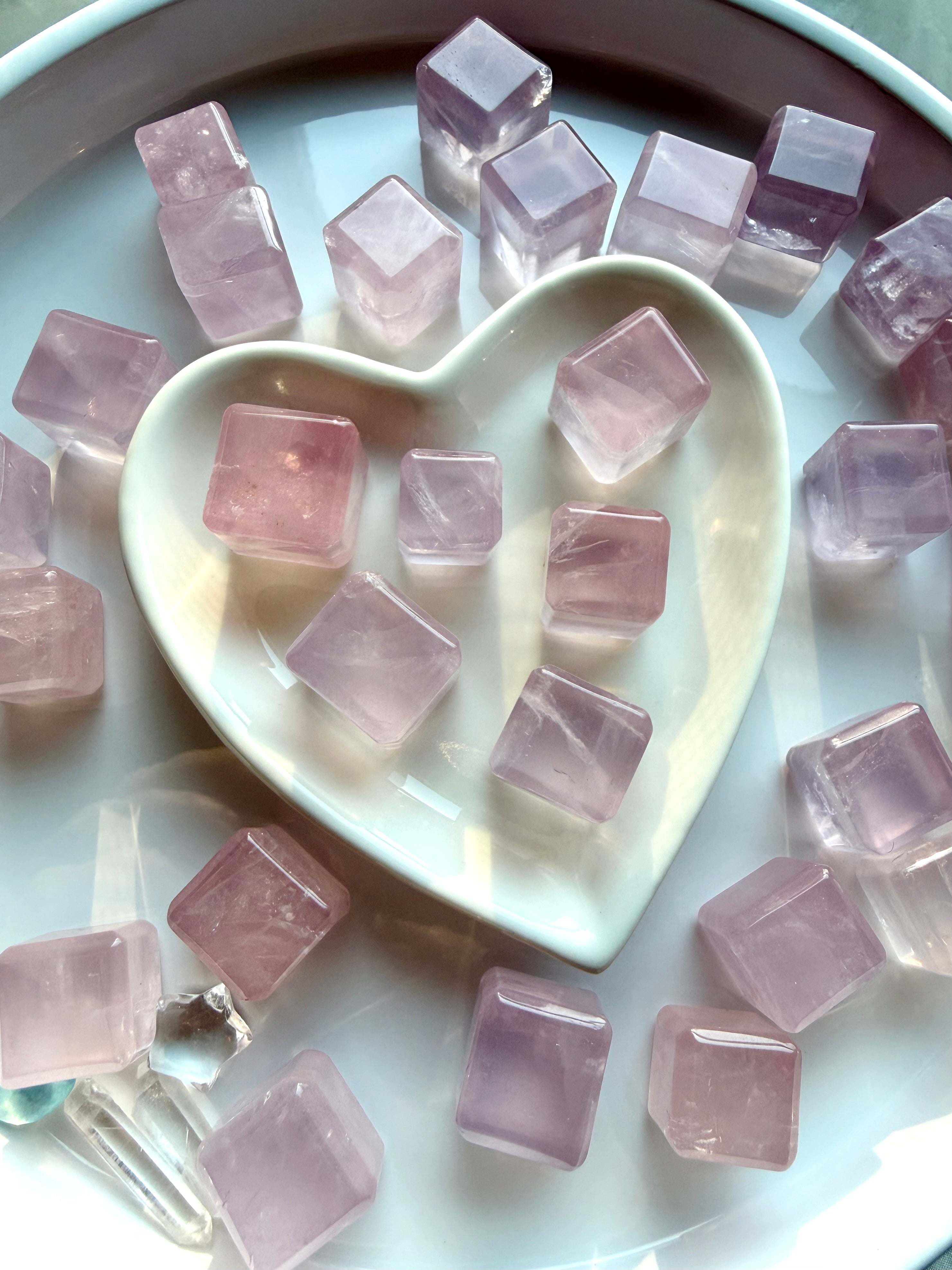Mini rose quartz cube styled in a white heart bowl with crystals, sacred geometry cube for love, harmony, and grounding