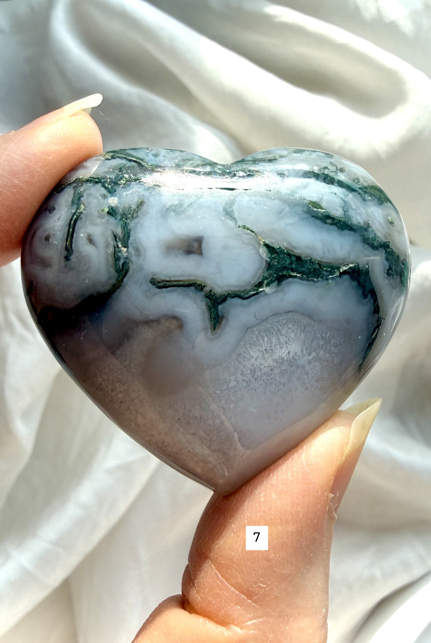 moss agate heart carving option 7 in hand with bold green inclusions and natural stone patterning
