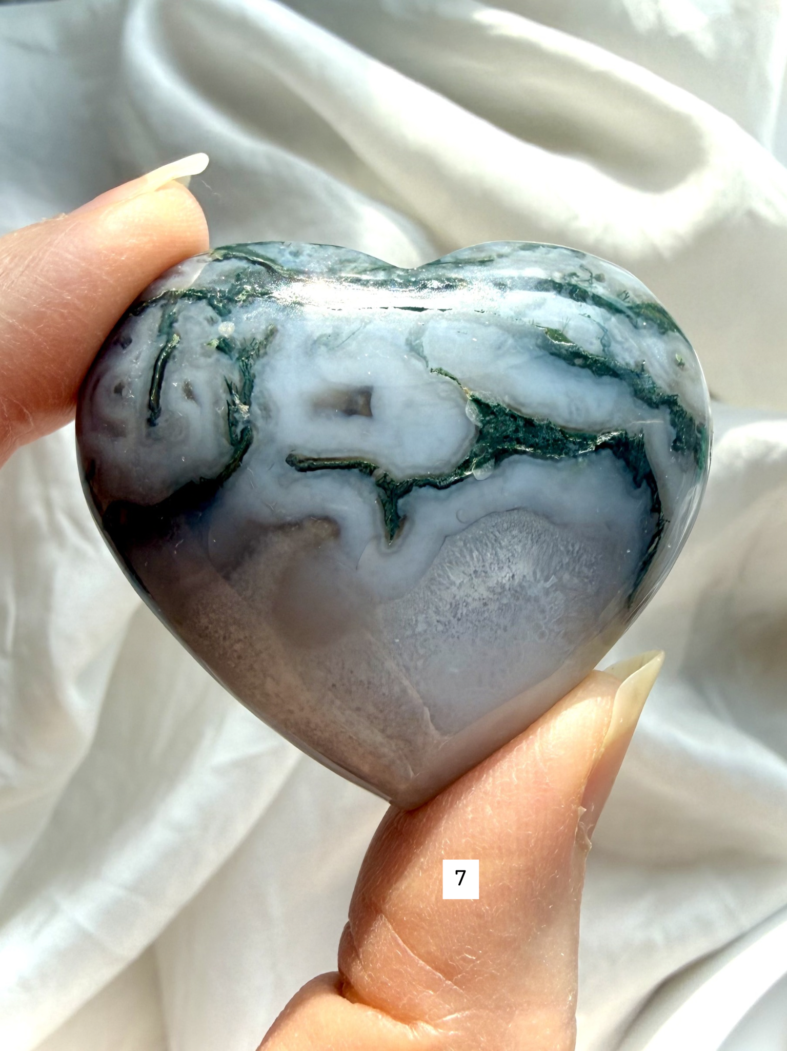 moss agate heart carving option 7 in hand with bold green inclusions and natural stone patterning