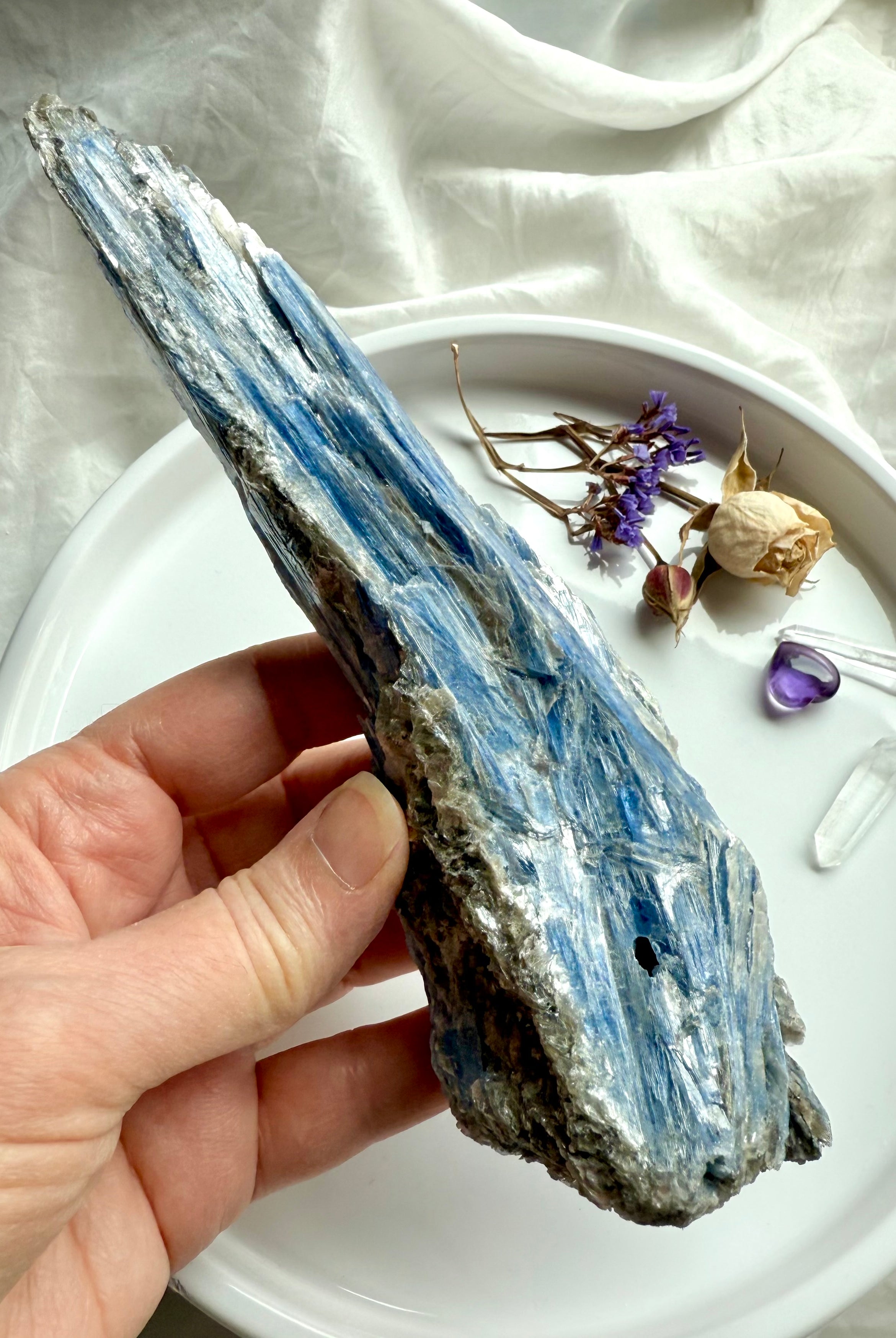 One of a kind raw blue kyanite and muscovite crystal specimen held in hand, natural healing stone for clarity and alignment