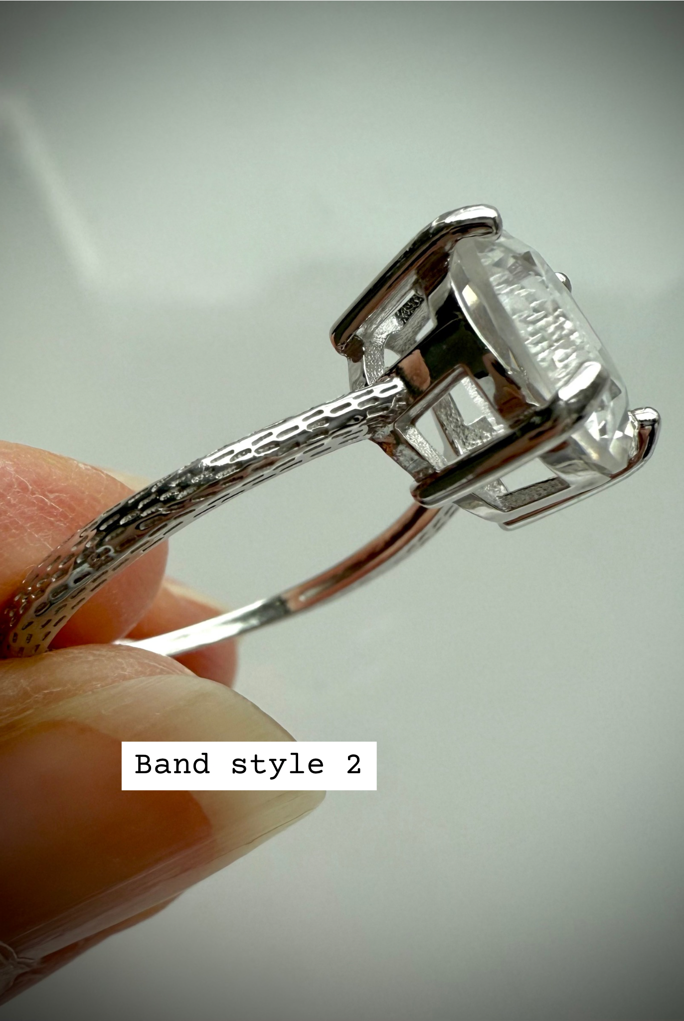 Side view of Band Style 2 – Clear Quartz Moon Ring with textured dotted silver band and raised setting