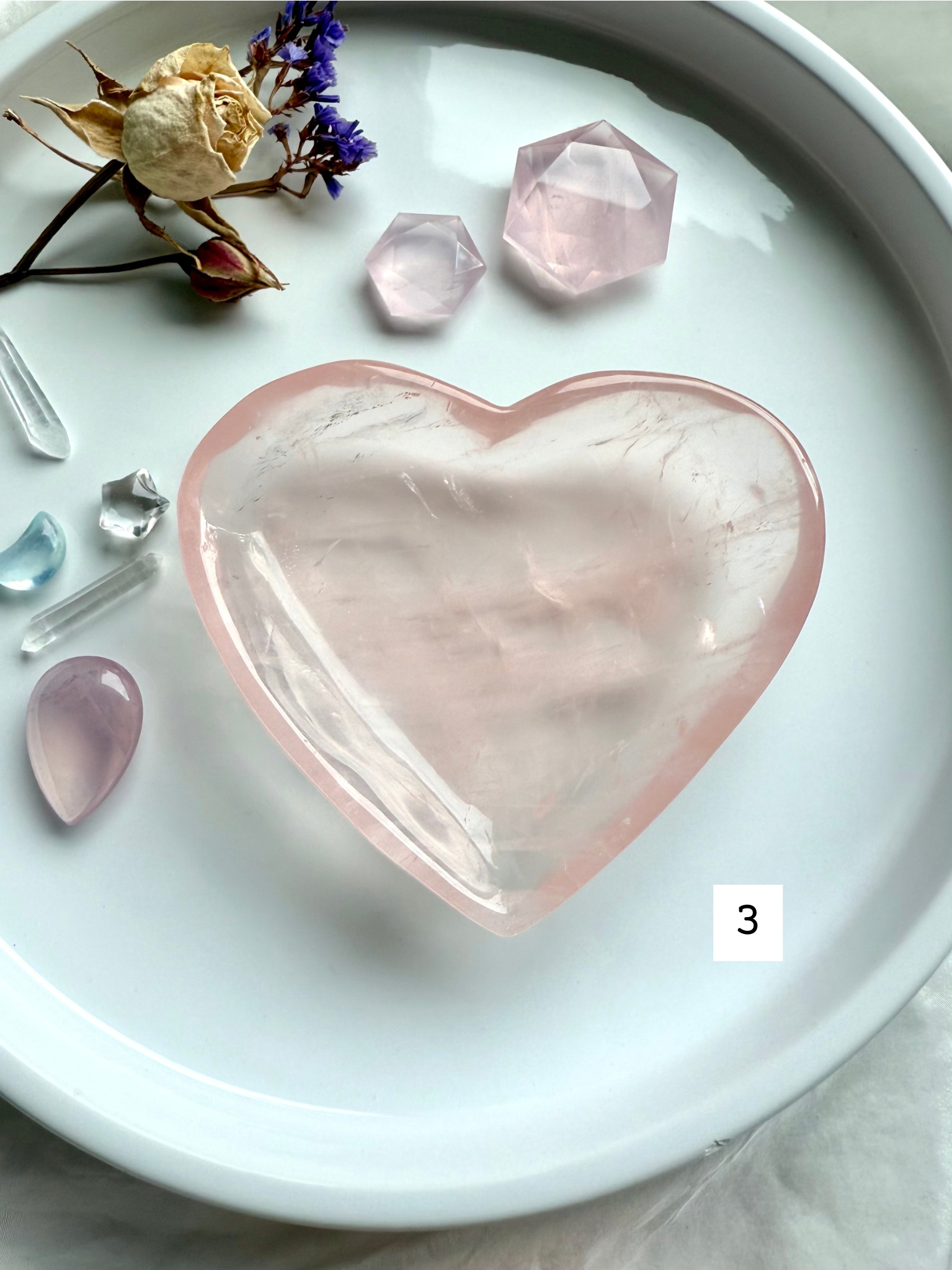 rose quartz heart bowl displayed with aquamarine and amethyst crystals, styled as a heart chakra offering dish for love, healing, and spiritual décor