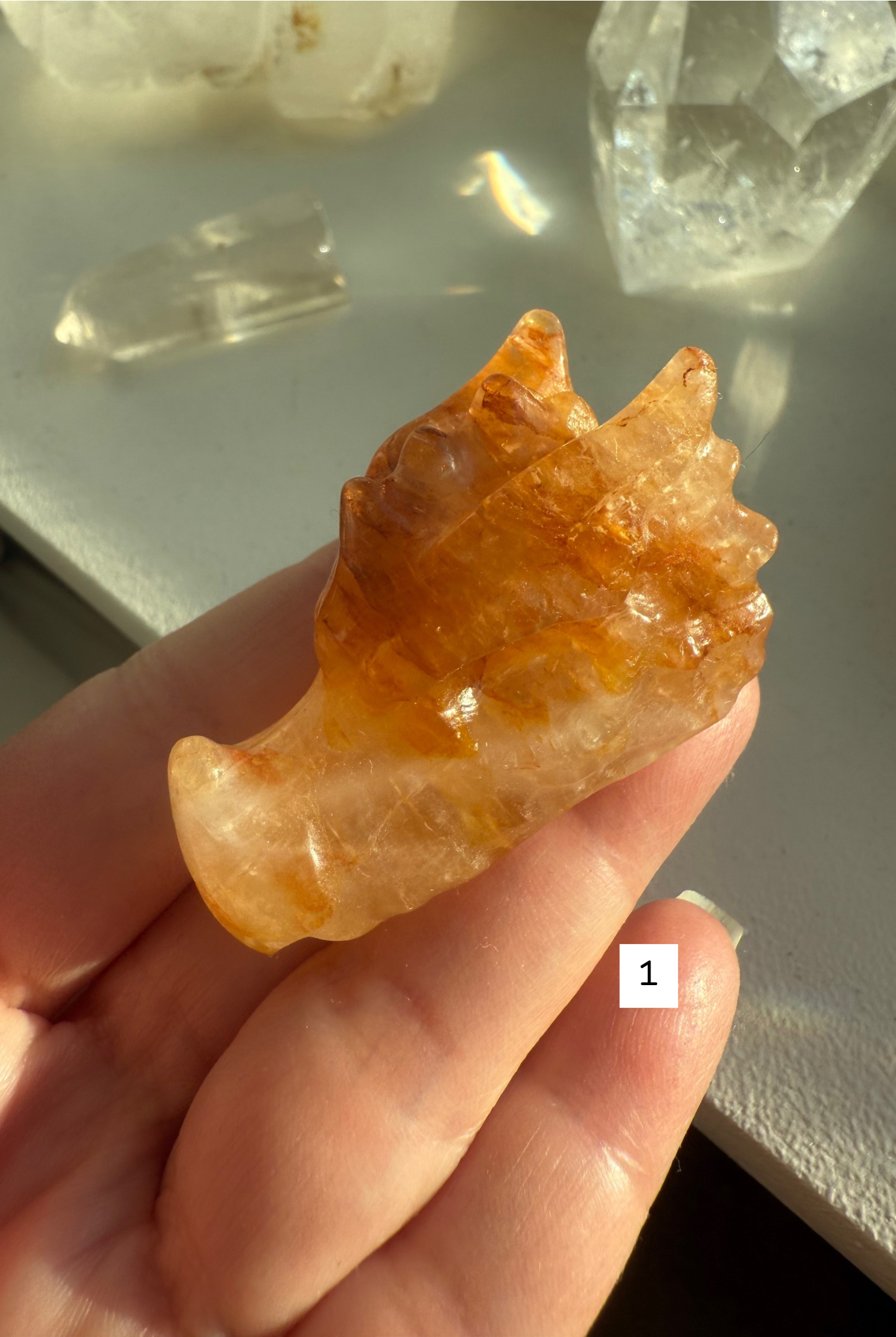 Small Golden Healer Quartz dragon head in hand, showing natural honey and bronze tones — gemstone carving for meditation, Solar Plexus activation, and spiritual gifting.