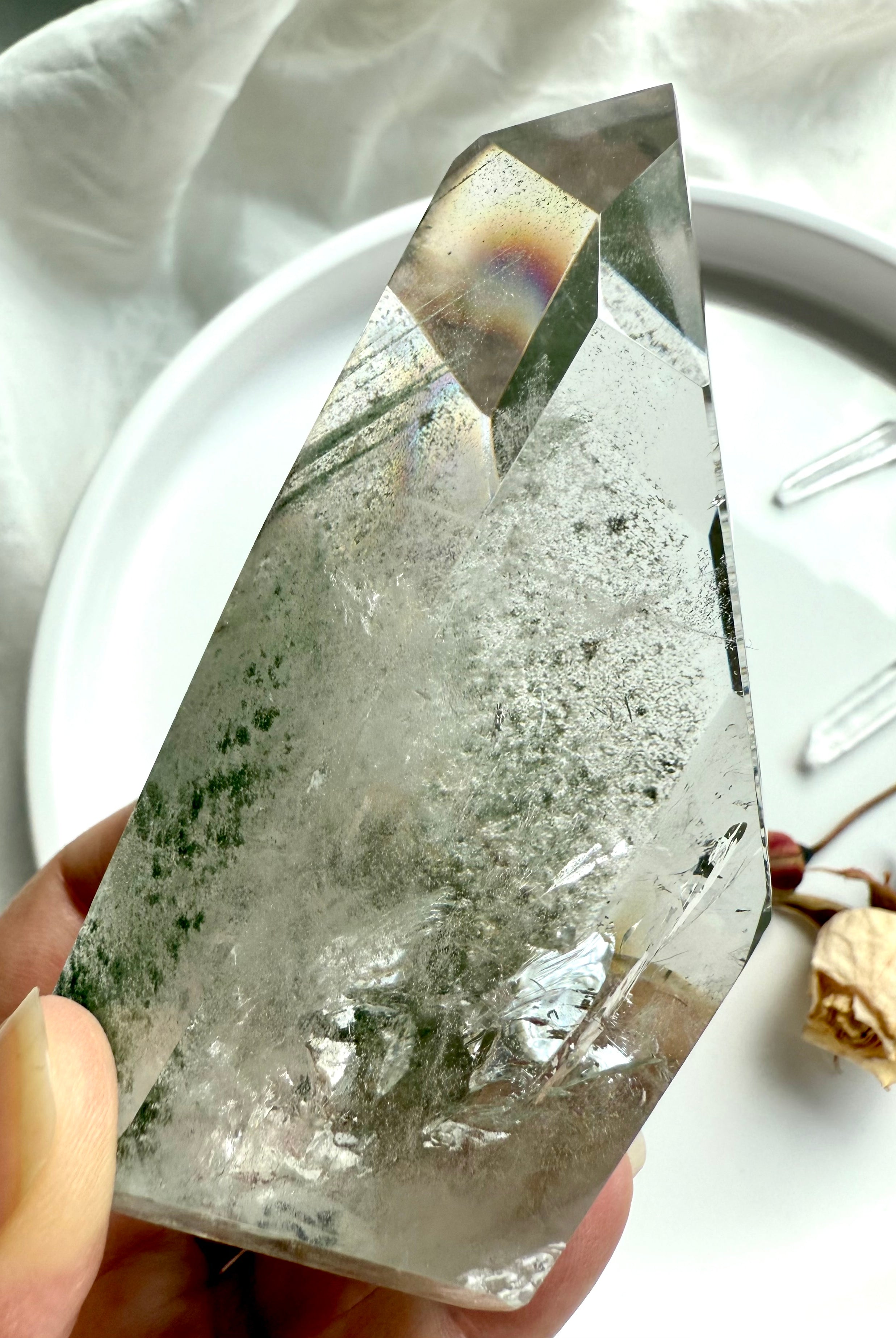 Polished Phantom Quartz tower with intricate green landscapes and exceptional transparency