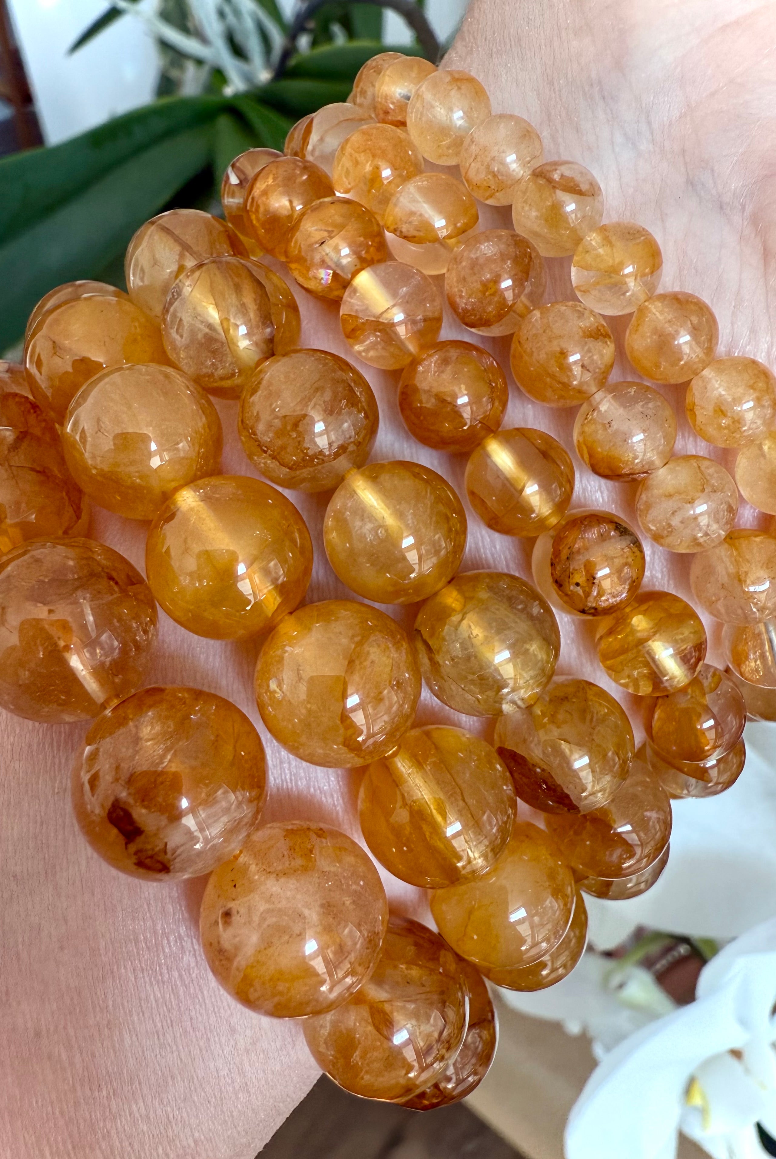 High-quality Golden Healer Quartz beads with rich golden inclusions and clear quartz transparency for solar plexus chakra healing.