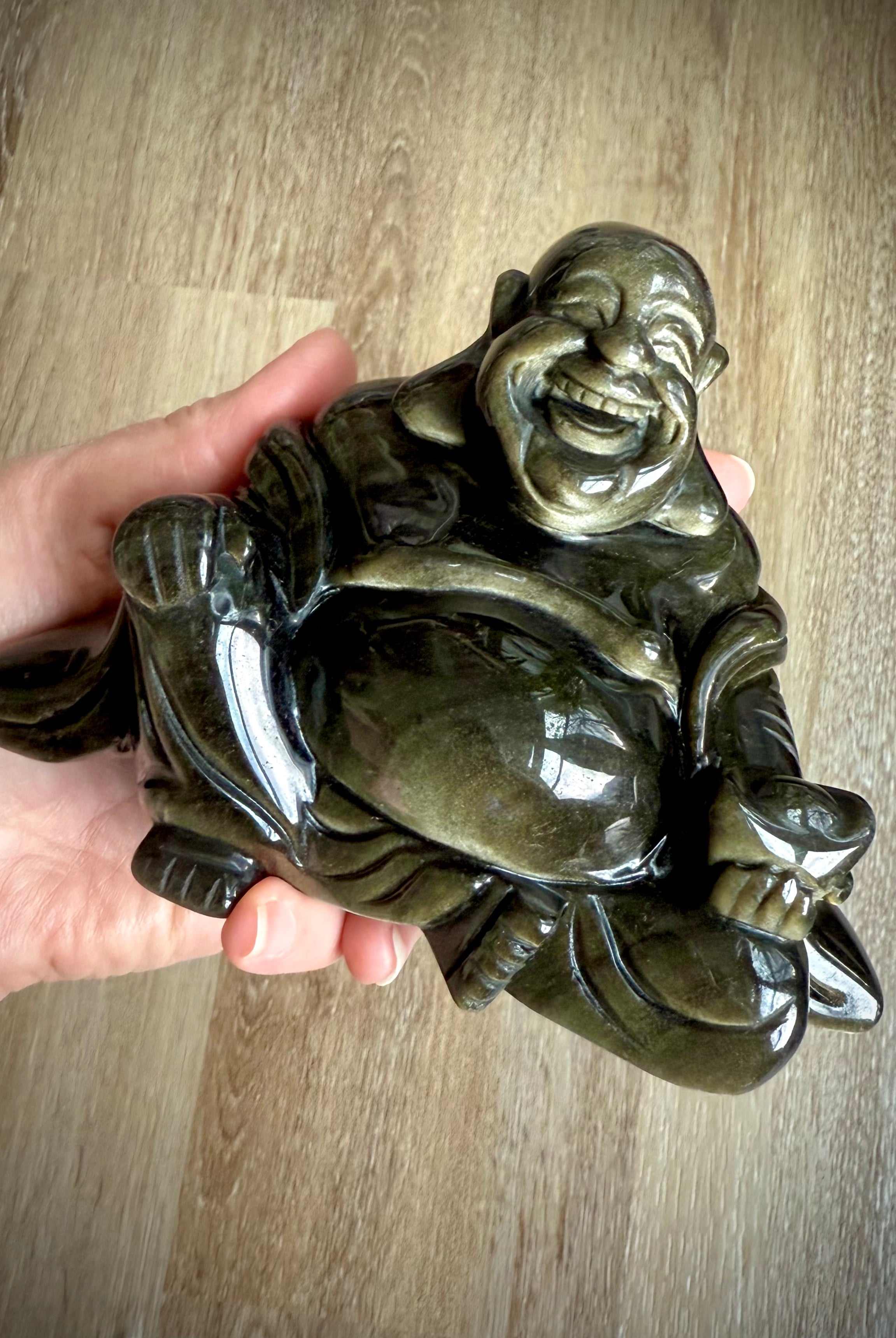 Shimmering Golden Sheen Obsidian Happy Buddha carving held in palm – crystal figurine for solar plexus chakra and energetic protection