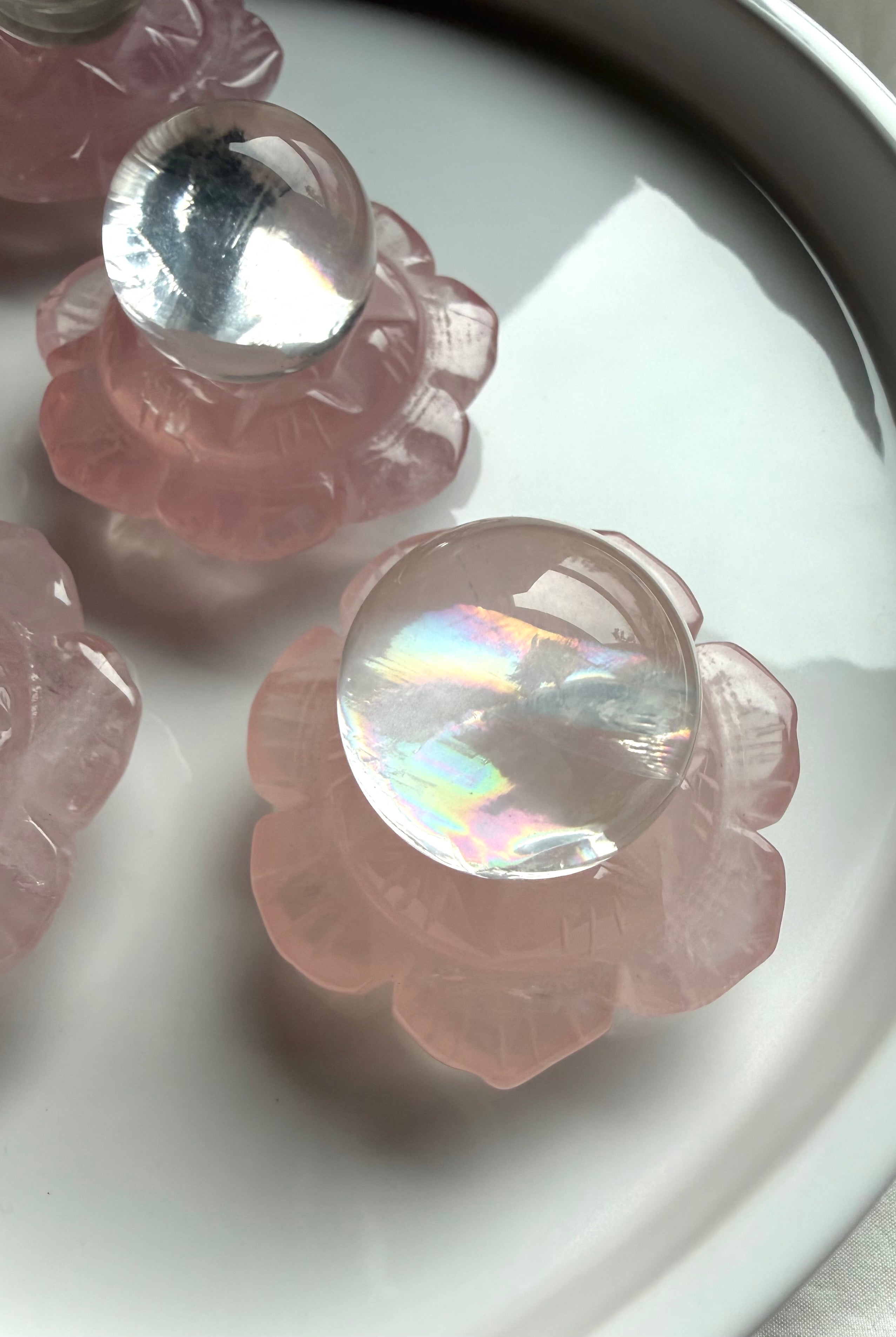 Mini girasol quartz crystal spheres styled in Rose Quartz lotus flower crystal holders, sacred home and altar decor