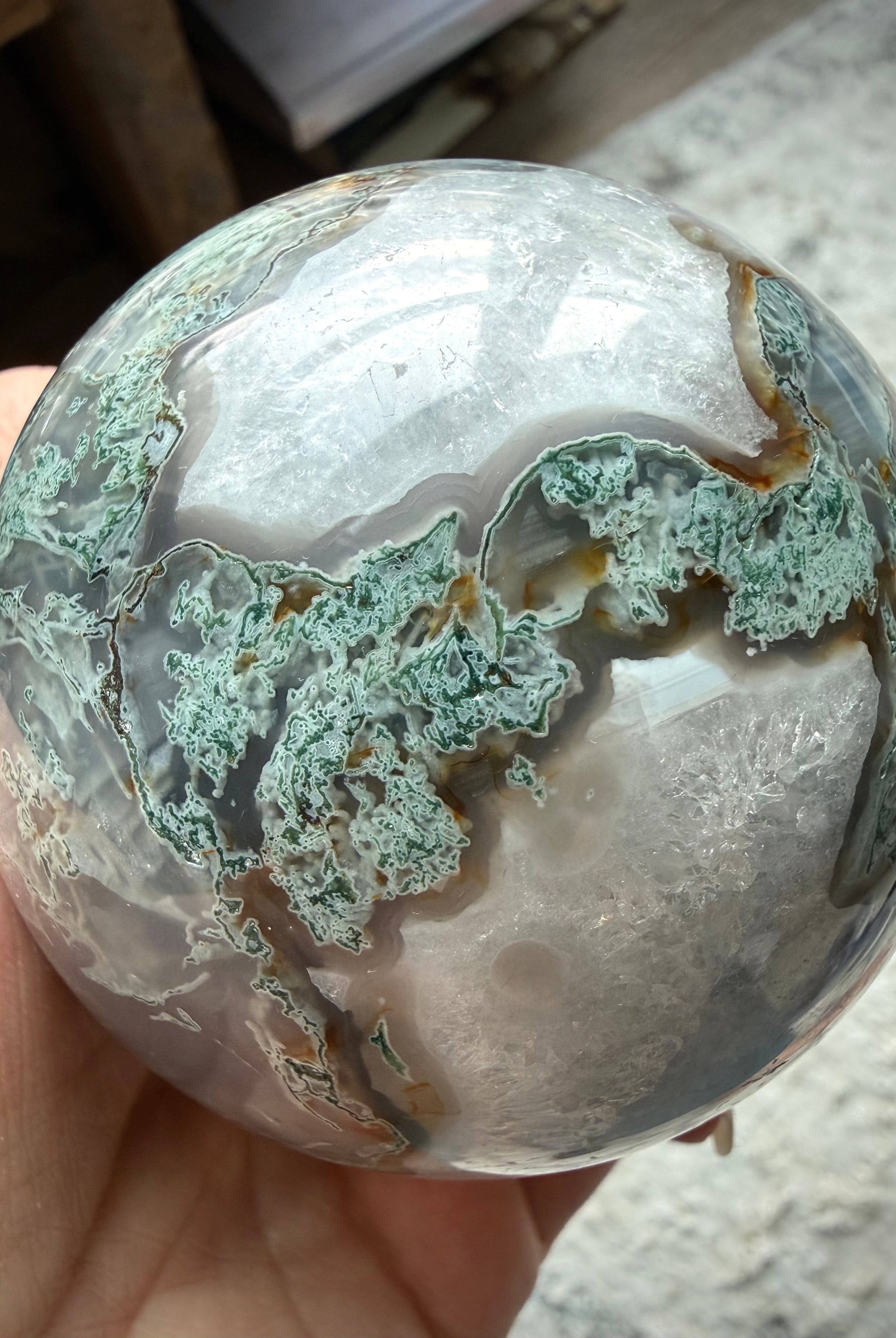 Polished Moss Agate crystal ball with garden-like inclusions and natural stone details