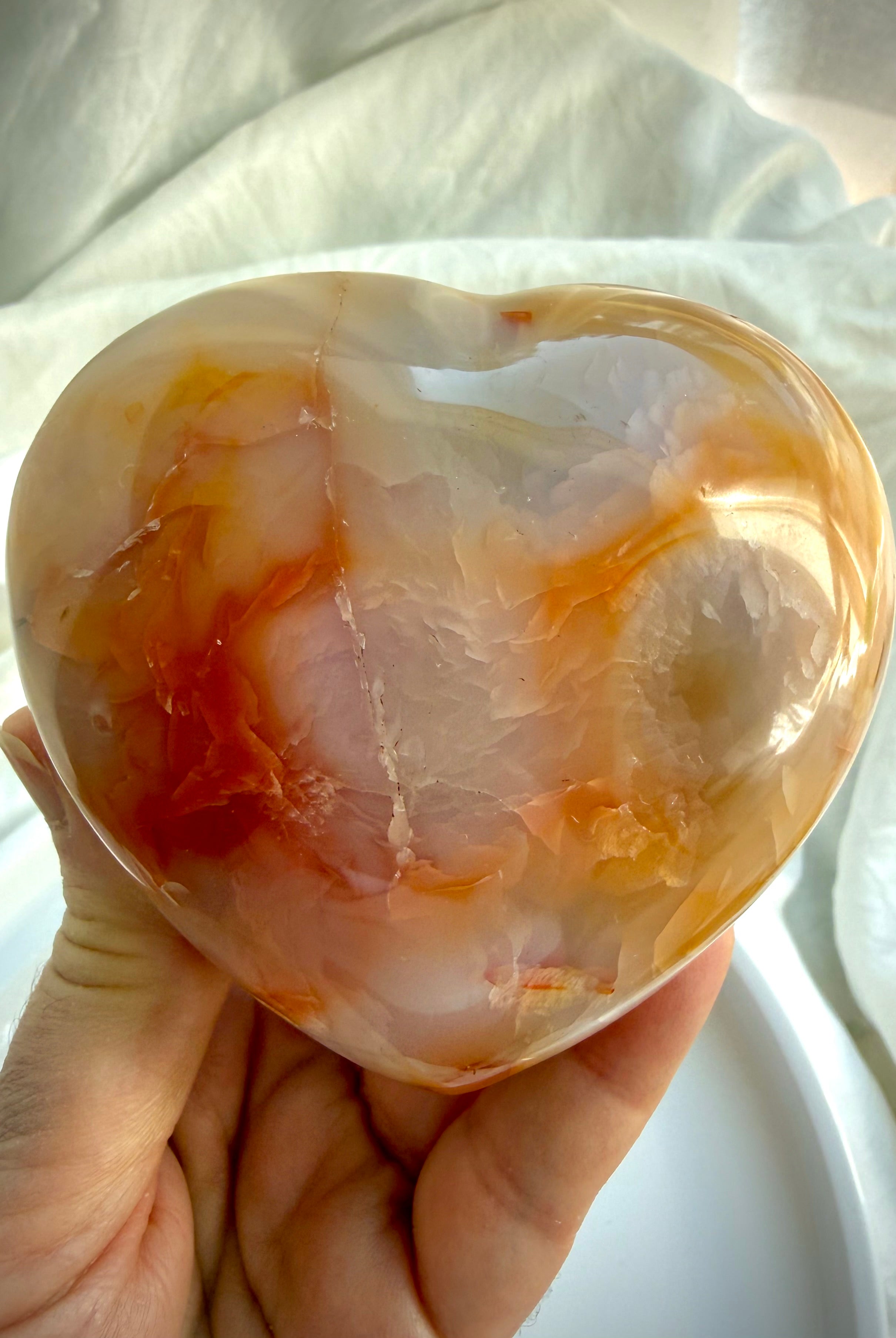 Back of one-of-a-kind Carnelian heart with warm orange, cream and honey banding in polished natural stone