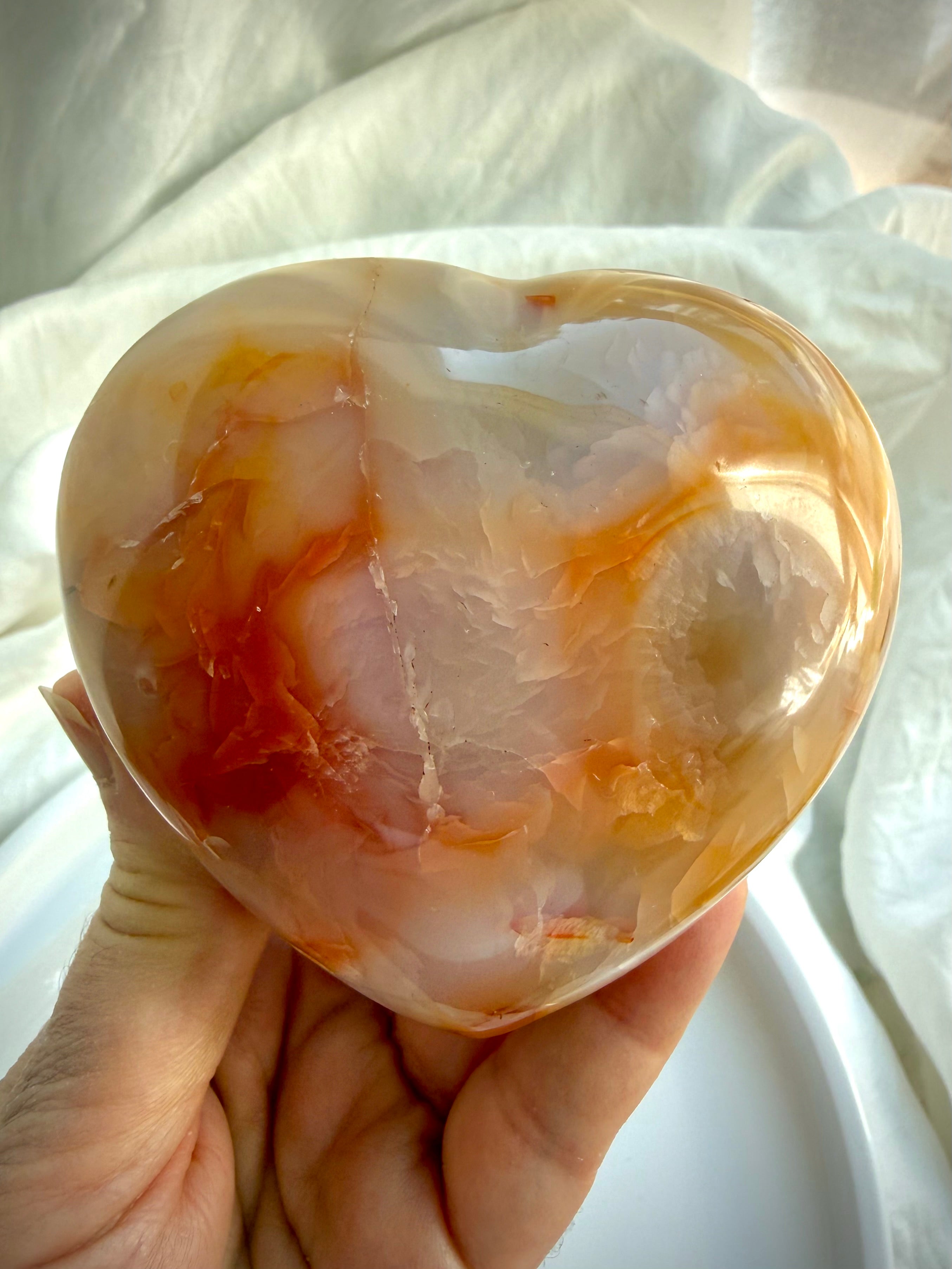 Back of one-of-a-kind Carnelian heart with warm orange, cream and honey banding in polished natural stone