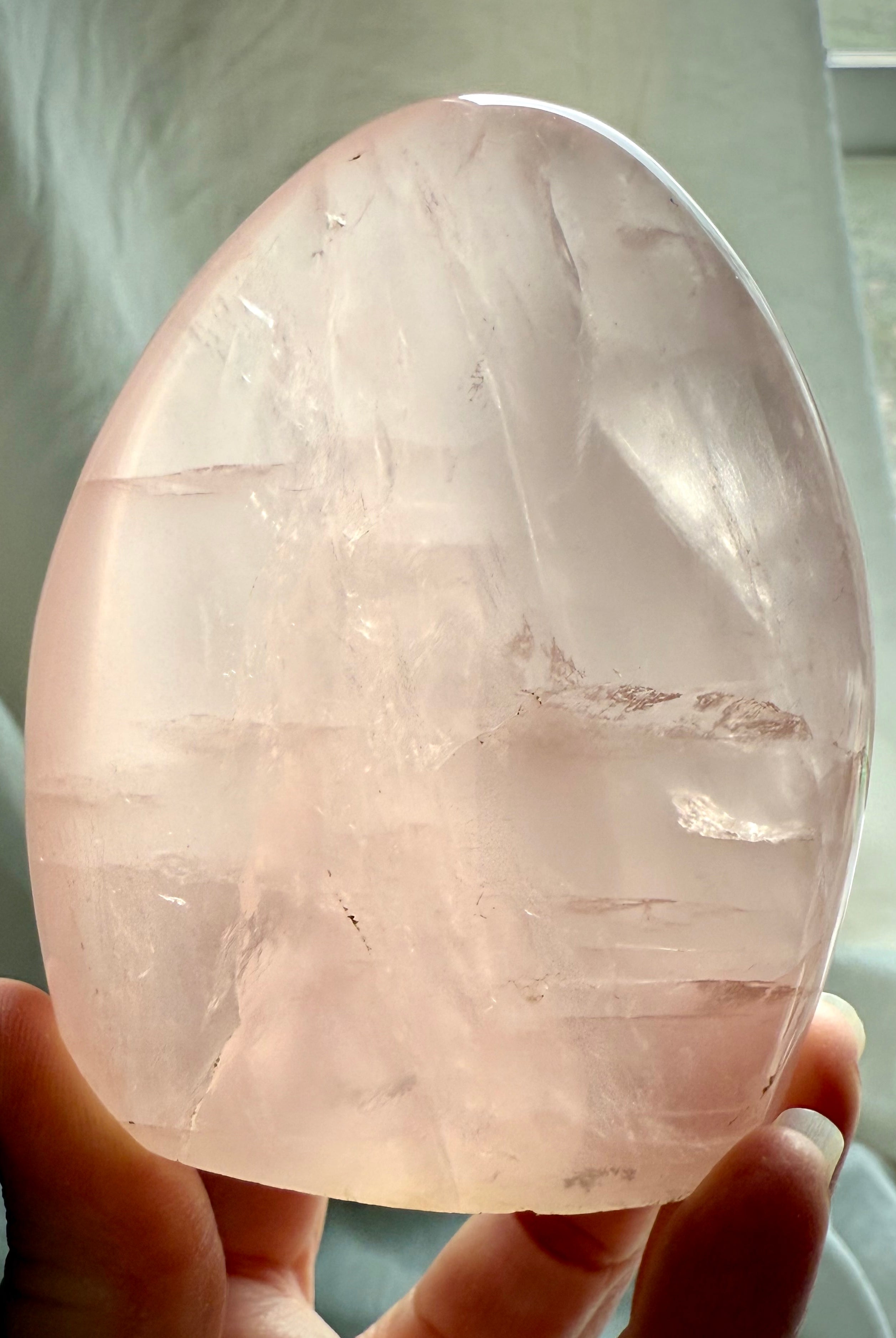Premium Rose Quartz freeform stone with glassy pink translucence and mystical light-filled appearance