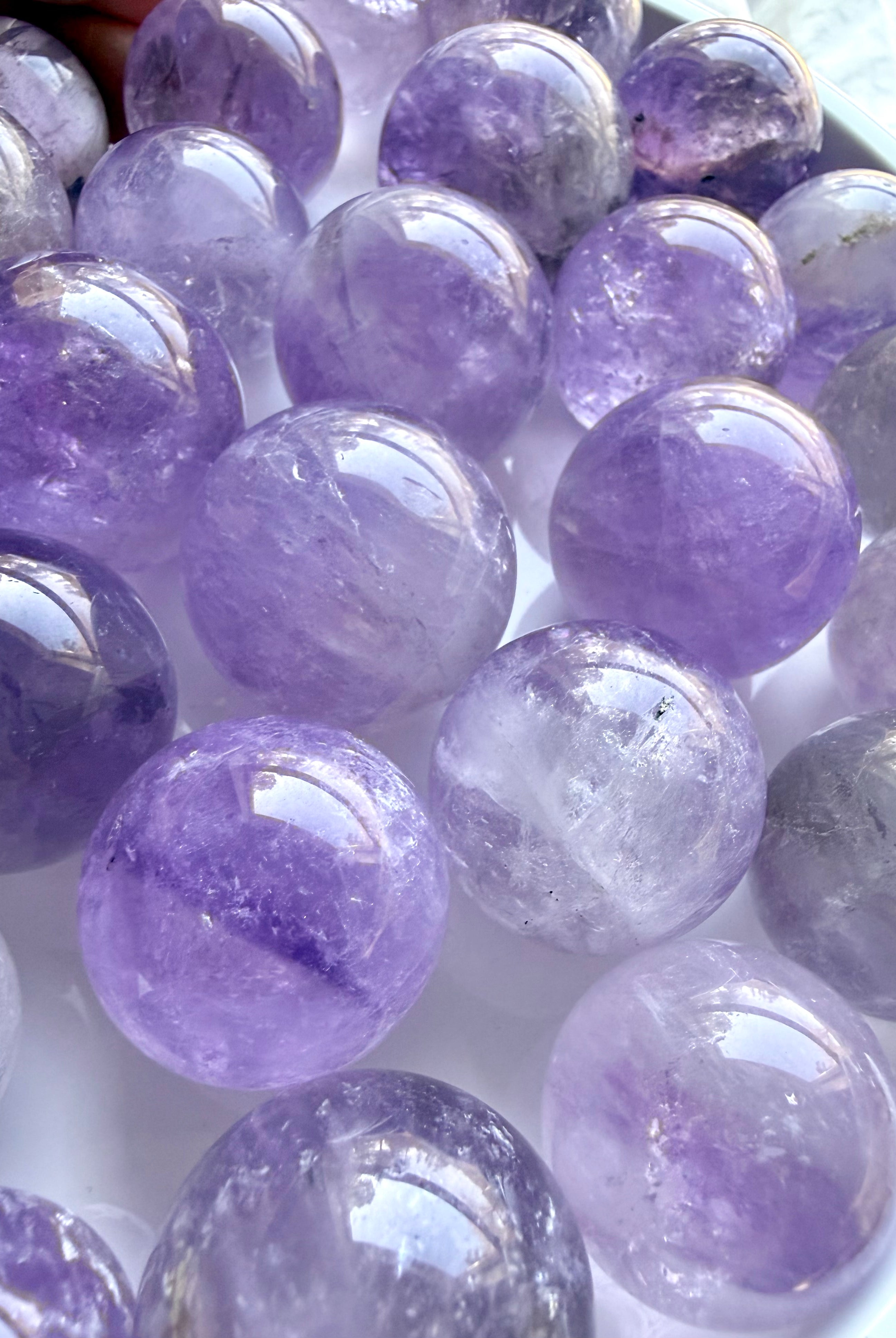 small amethyst crystal balls with smoky inclusions polished mini gemstone spheres