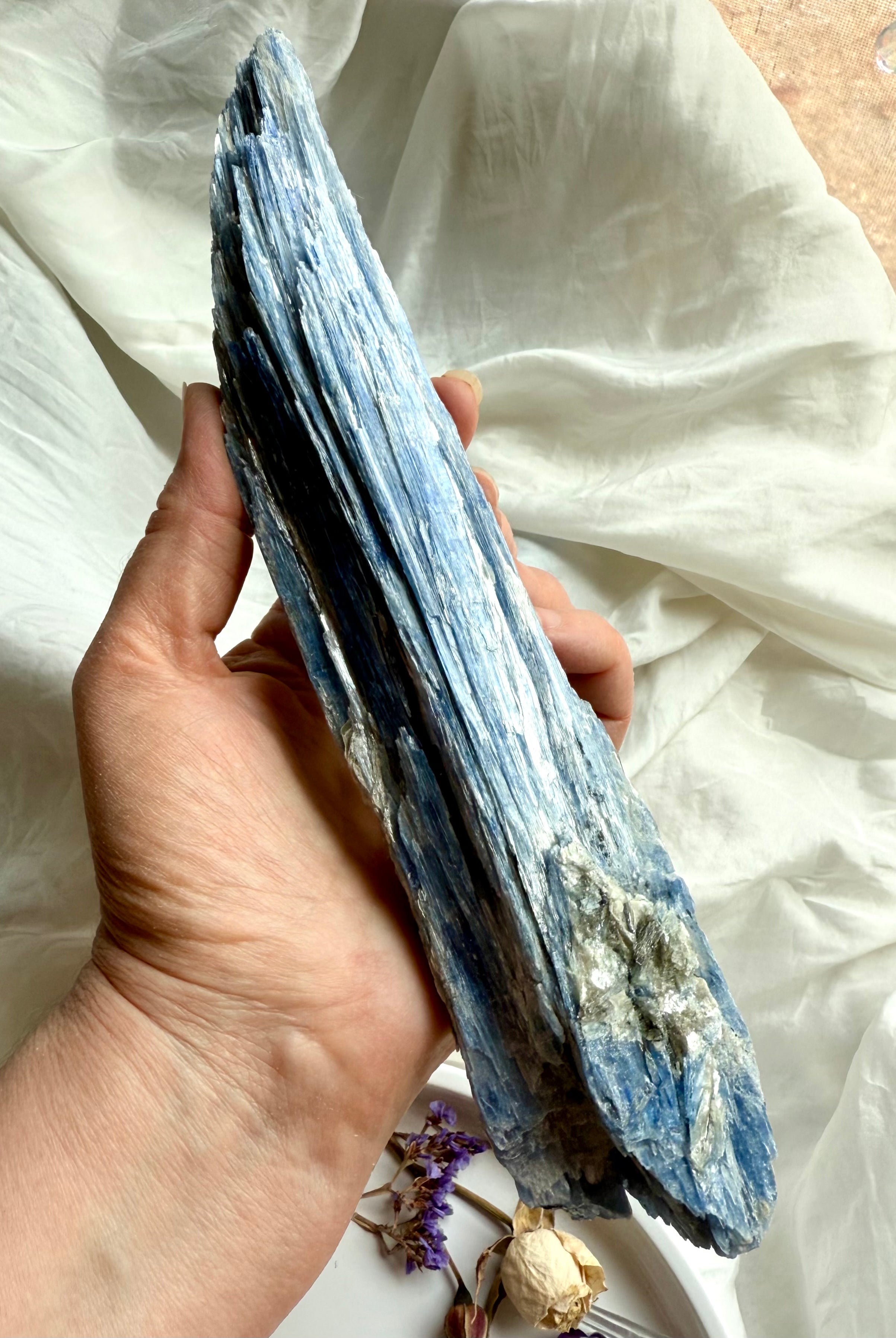 Handheld blue kyanite blade with quartz inclusion, raw throat chakra healing crystal for energy cleansing + alignment