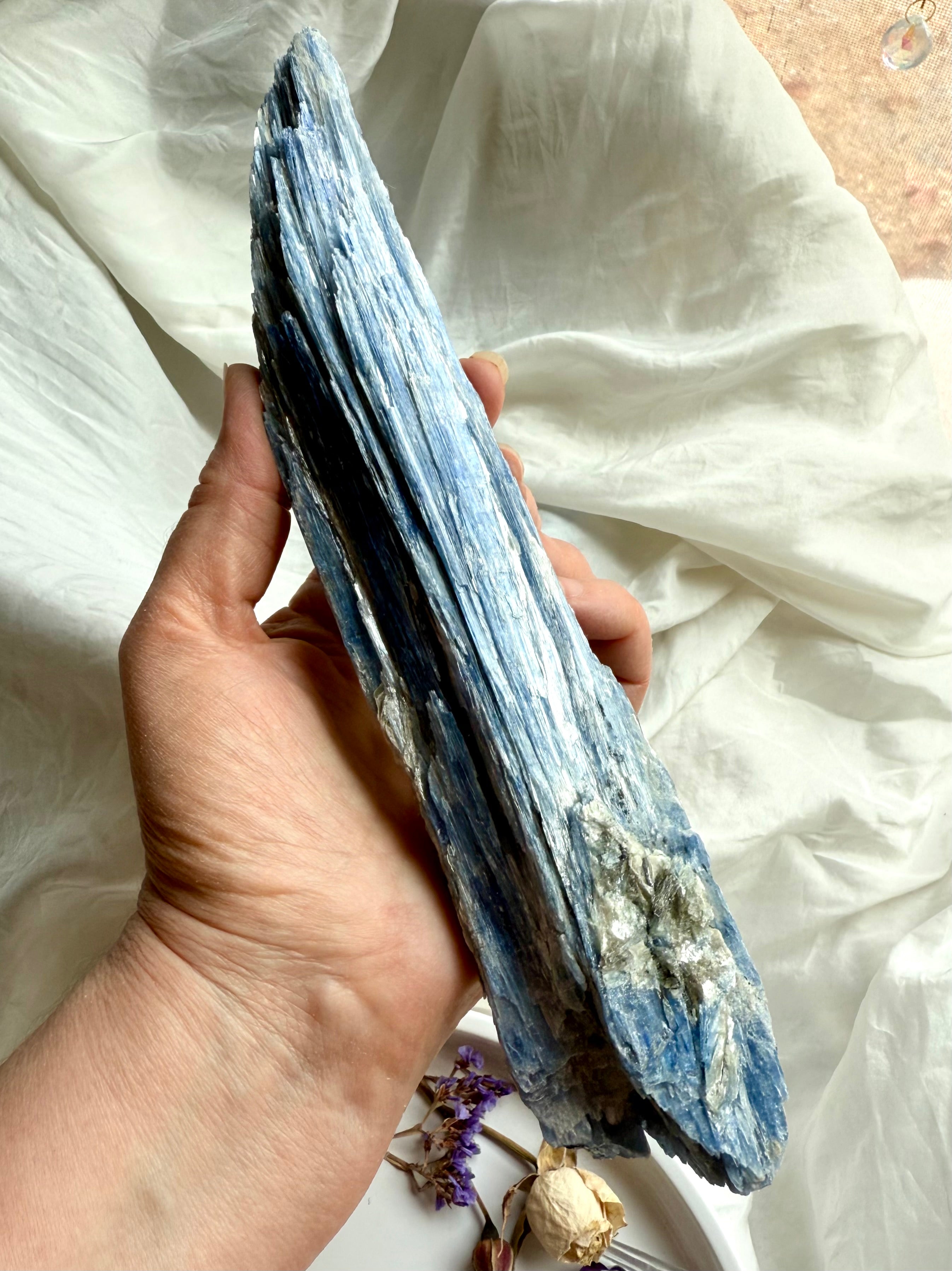 Handheld blue kyanite blade with quartz inclusion, raw throat chakra healing crystal for energy cleansing + alignment
