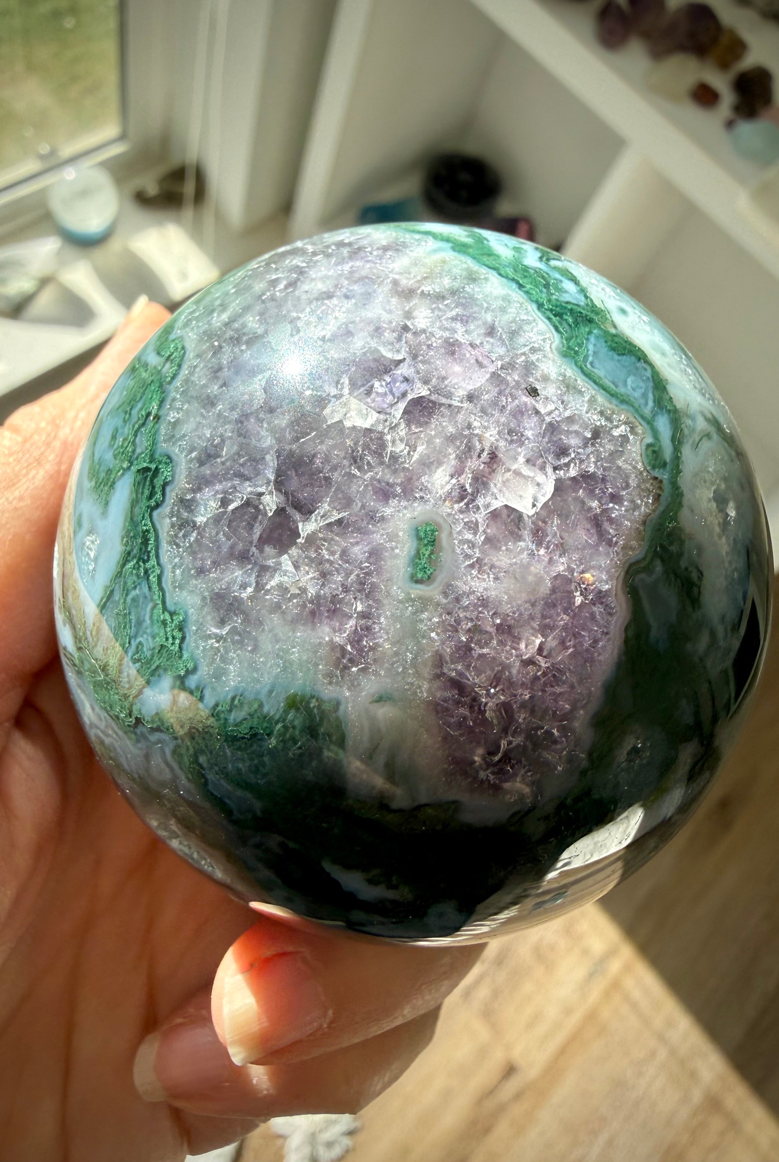 Amethyst druzy surrounded by Moss Agate in a rare crystal sphere with purple and green natural patterns
