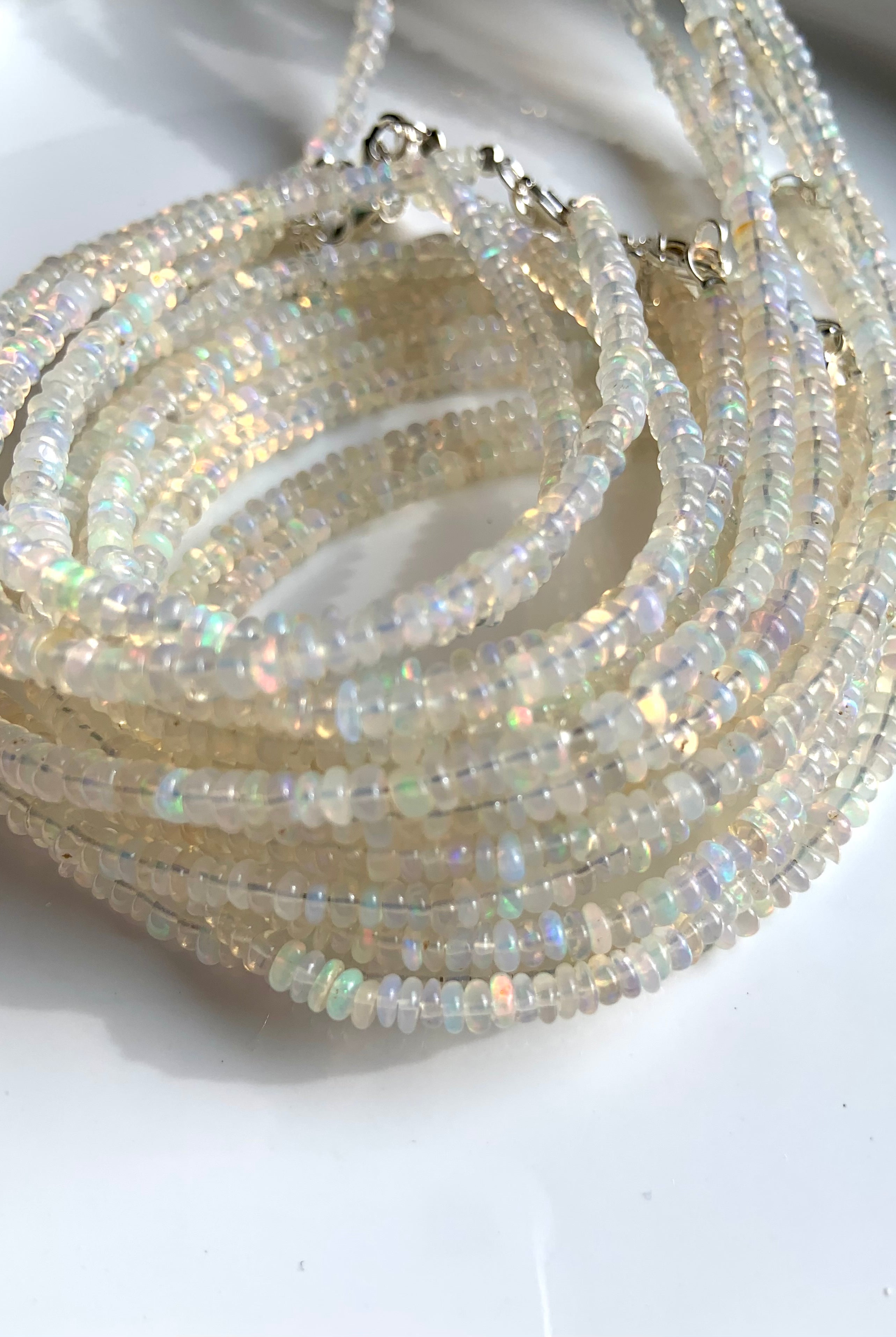 A lustrous stack of Ethiopian Opal Bracelets