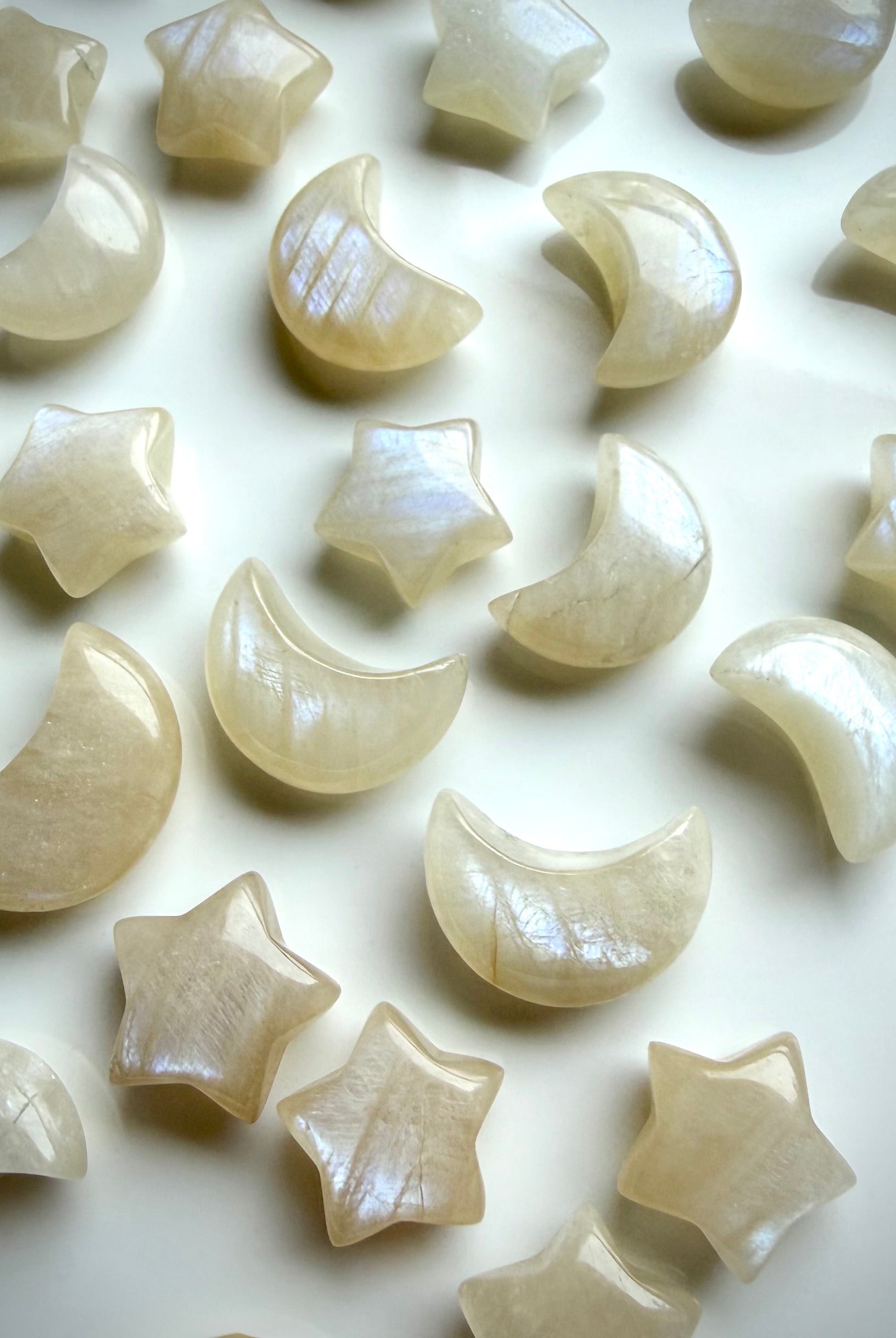Moonstone moon and star carvings with natural shimmer and creamy ivory glow