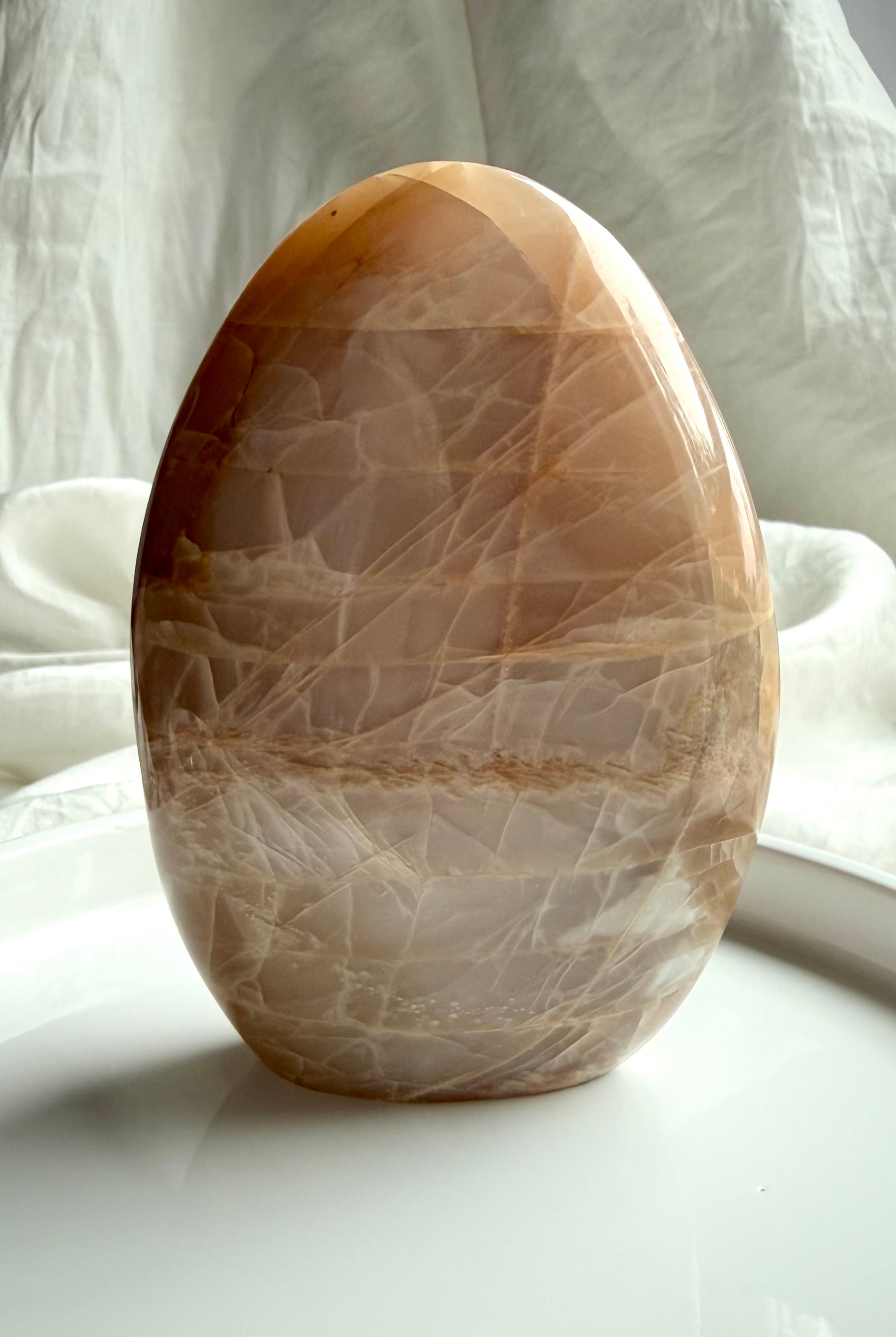 Peach Moonstone crystal freeform from Madagascar with soft glow, natural banding, and polished finish