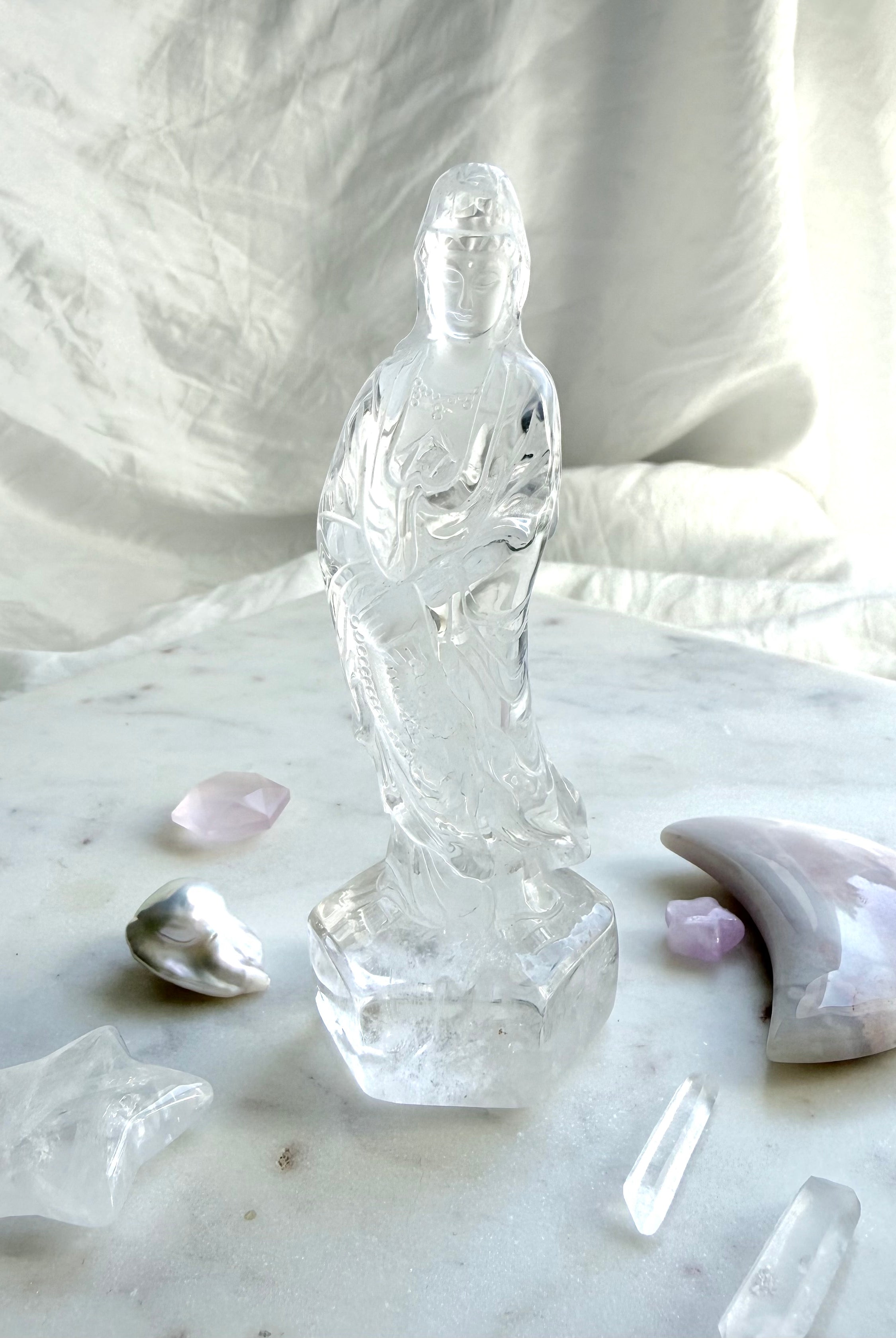 Clear Quartz Quan Yin statue carved from luminous crystal with exceptional clarity and serene goddess details