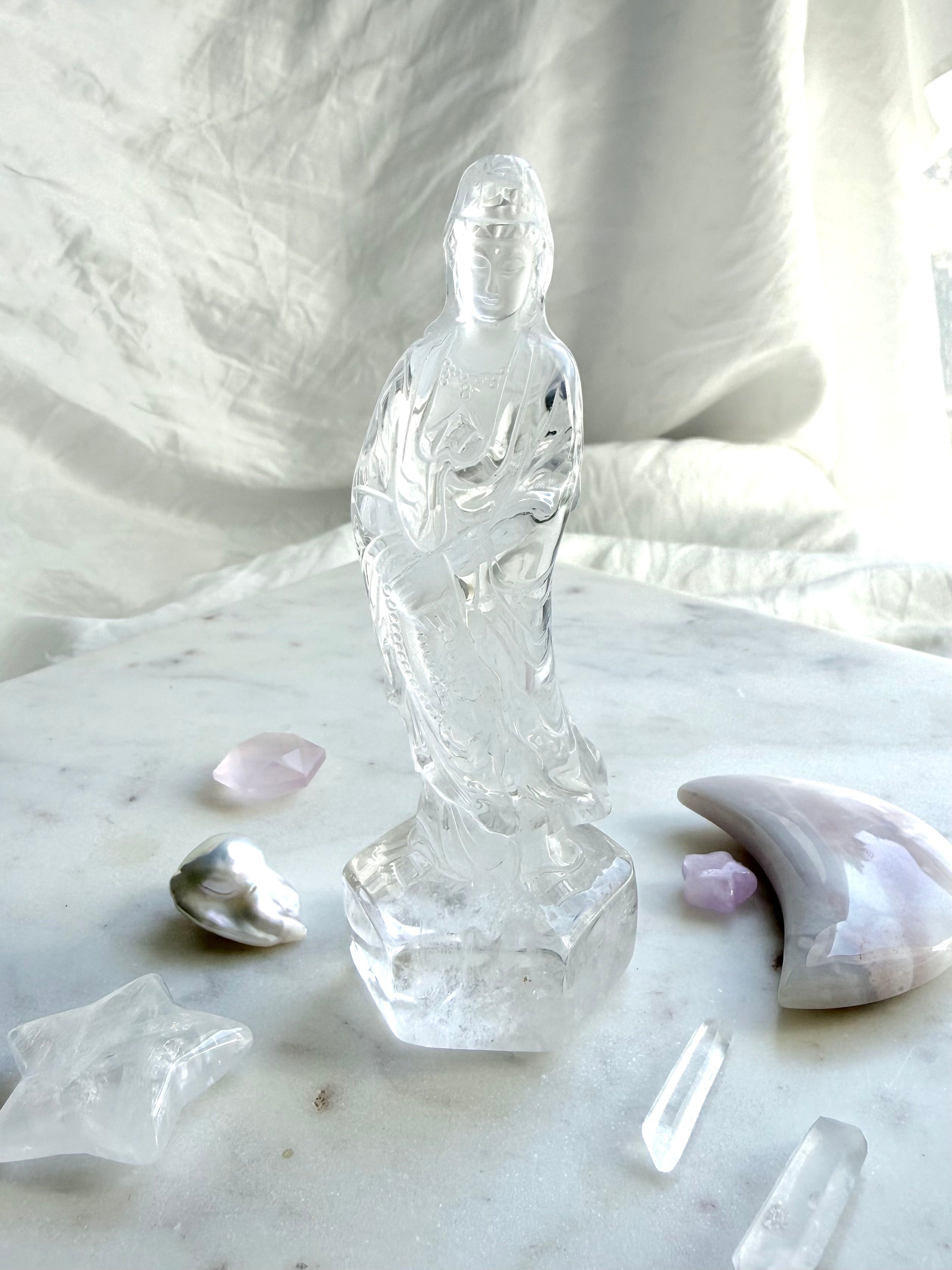 Clear Quartz Quan Yin statue carved from luminous crystal with exceptional clarity and serene goddess details