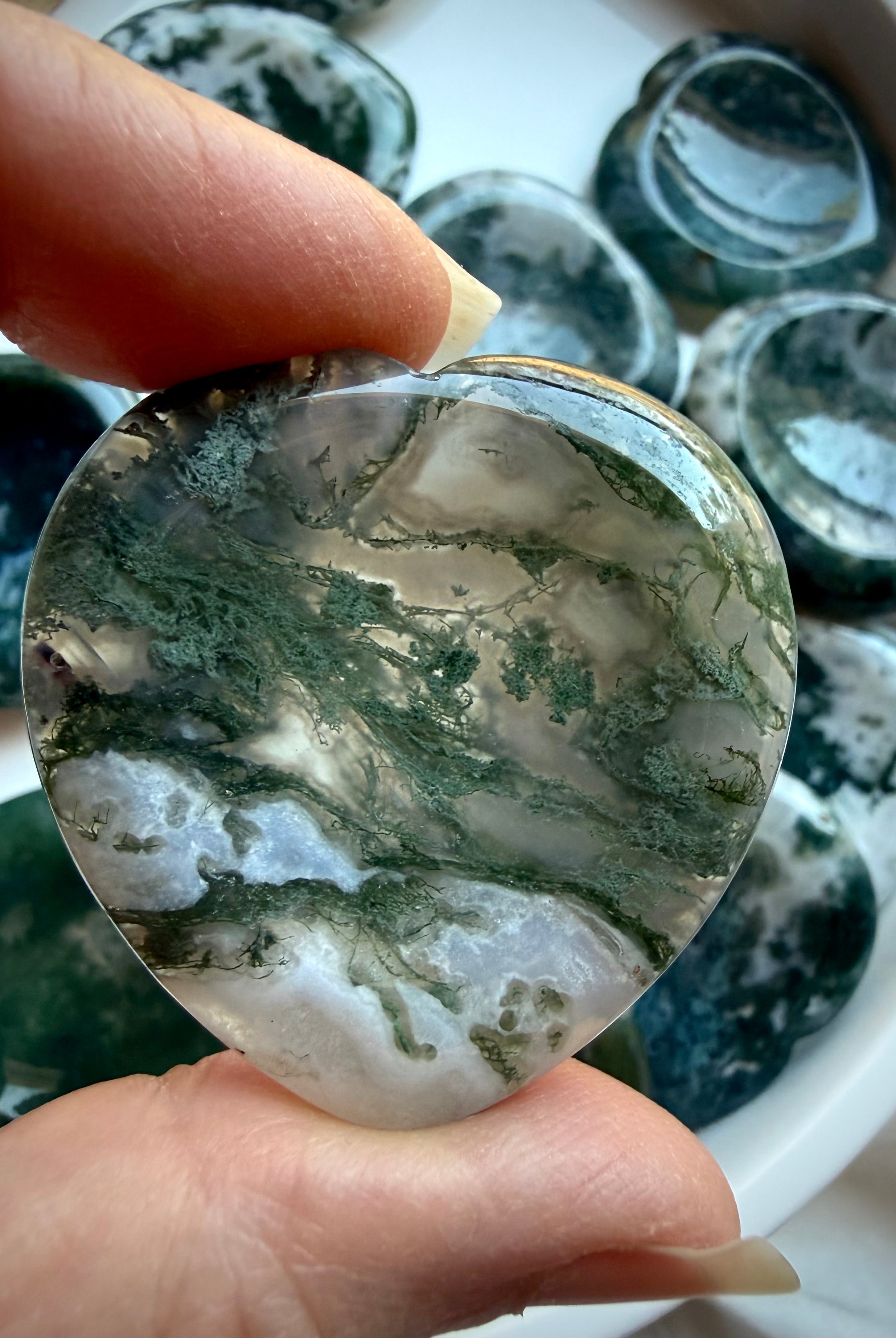 Moss Agate heart worry stones with translucent quartz, moss inclusions and polished heart shapes