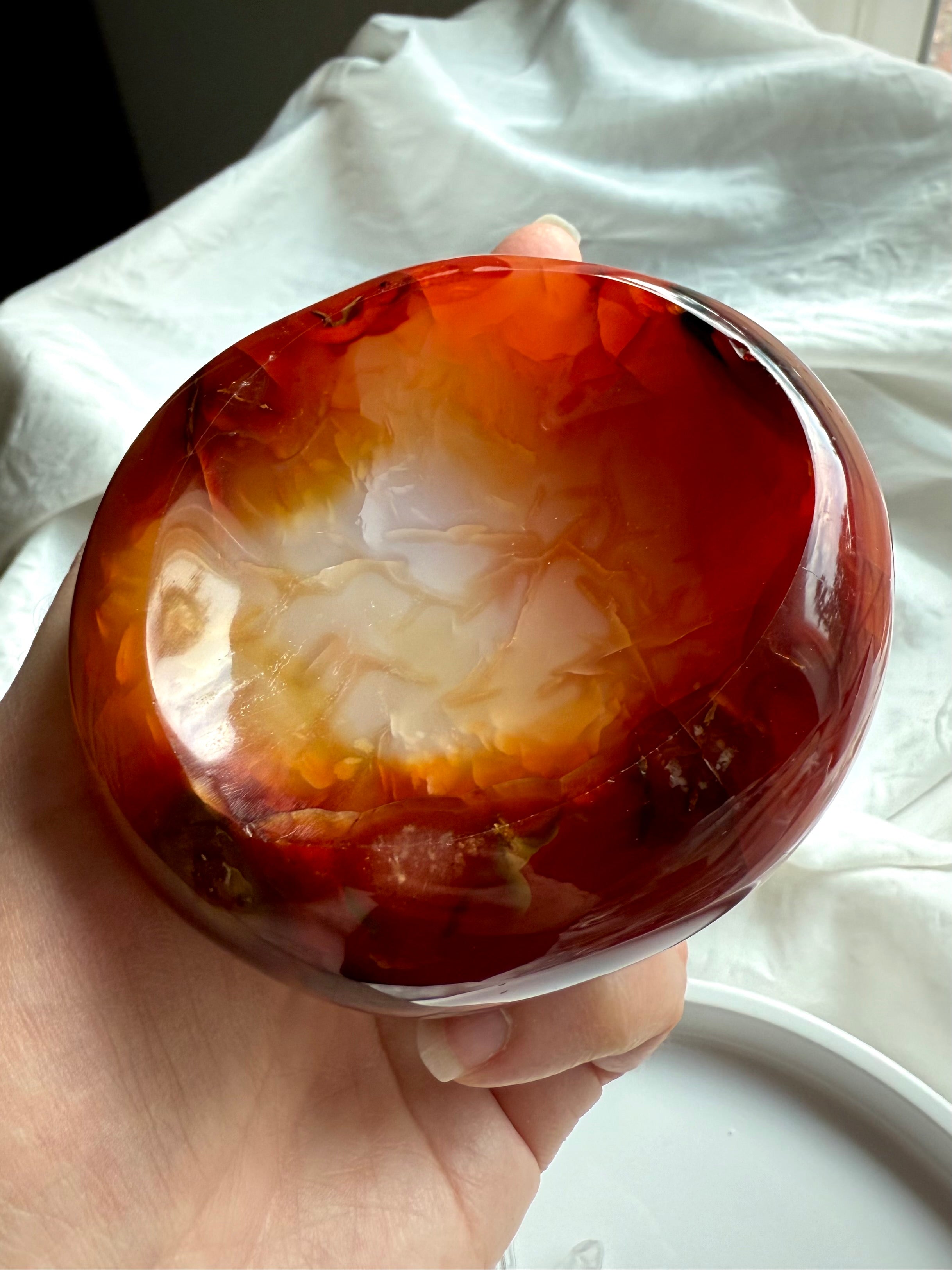 Carnelian altar bowl in hand – polished gemstone dish for creative energy and ritual offerings