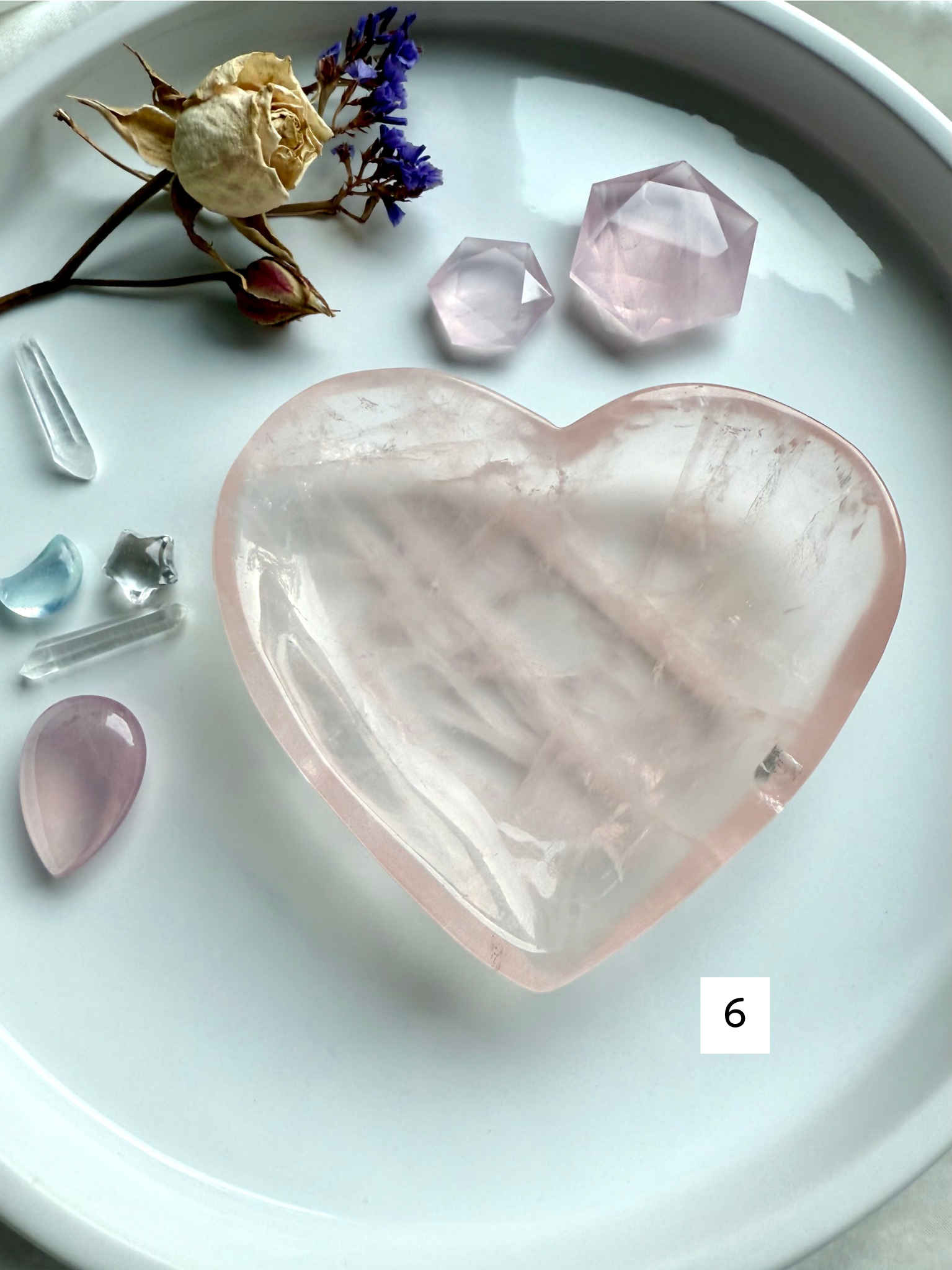 close-up rose quartz heart bowl with soft pink clarity and natural inclusions, heart chakra crystal dish for love, emotional healing, and high-vibe décor