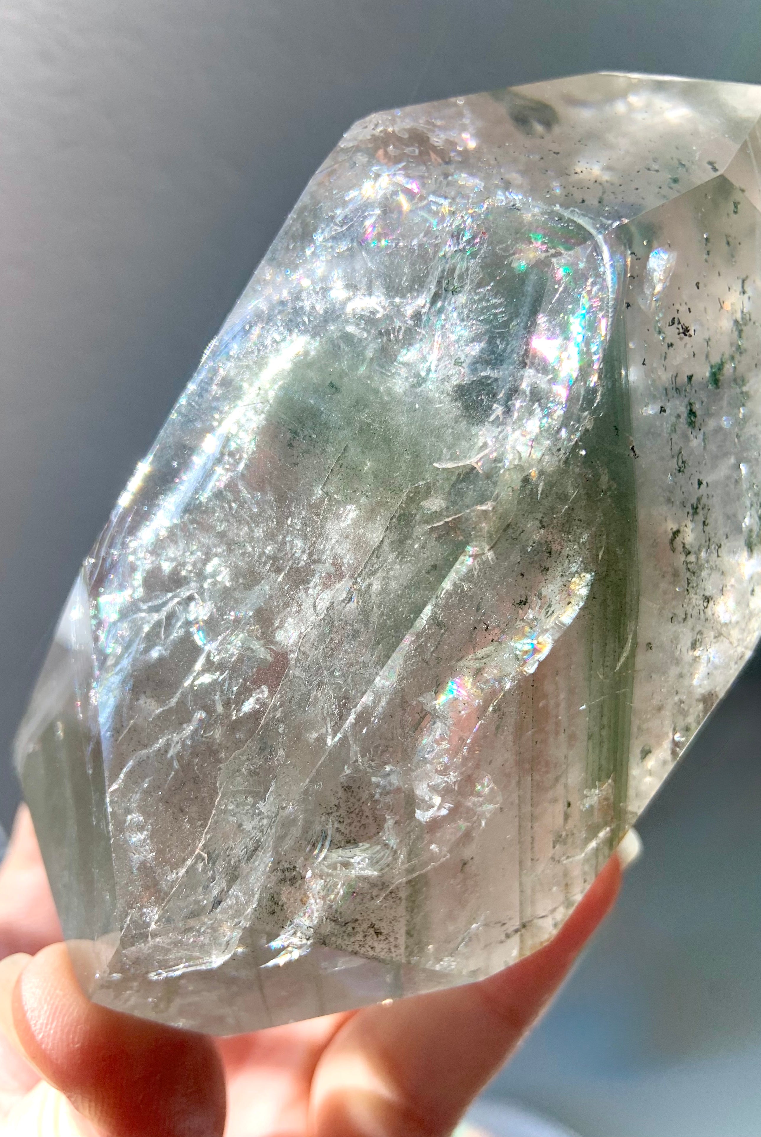 This Garden Quartz Crystal is filled with rainbows, chlorite phantoms, mossy mineral inclusions