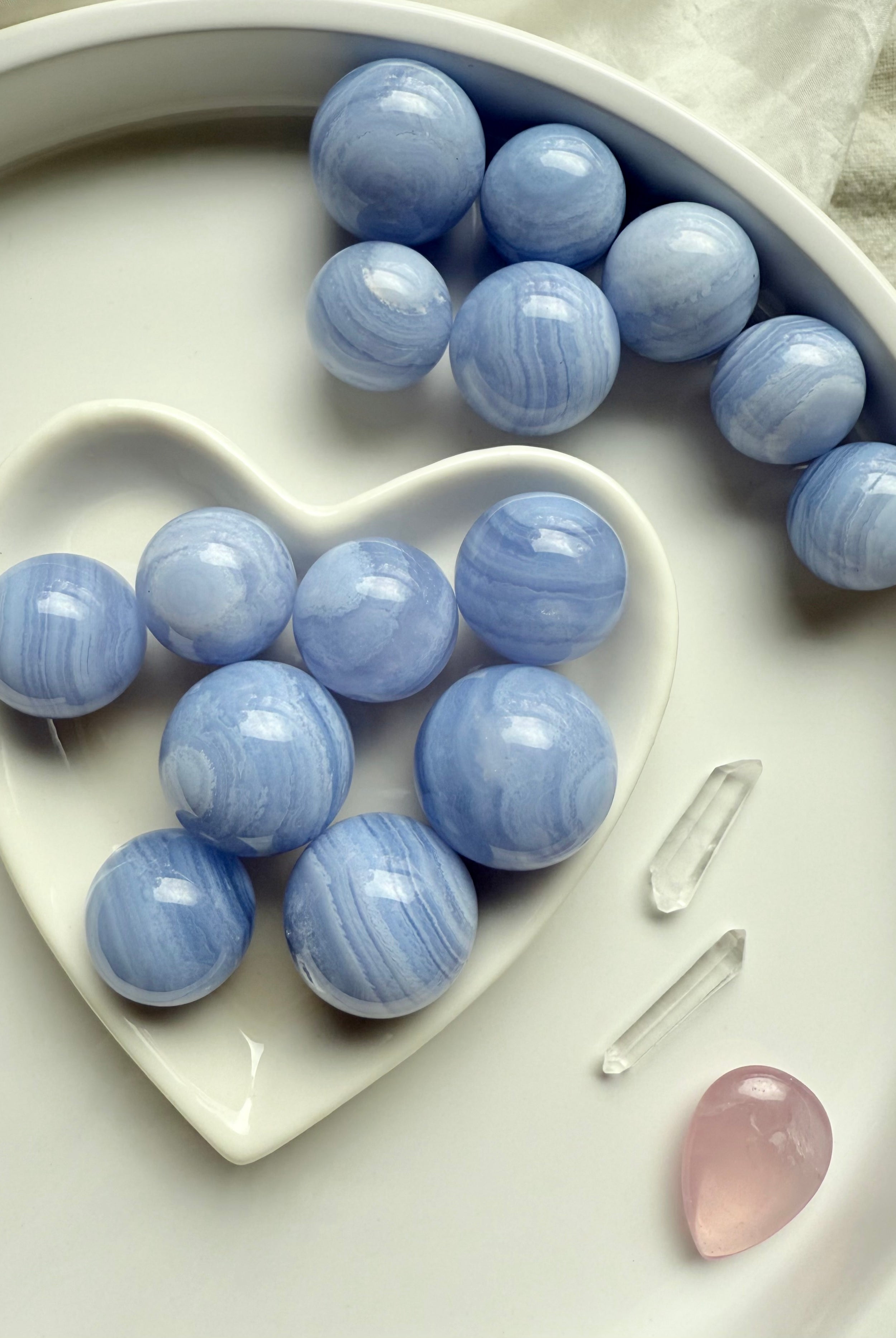 Soothing Blue Lace Agate is a throat chakra crystal of clear, heart-centered communication.