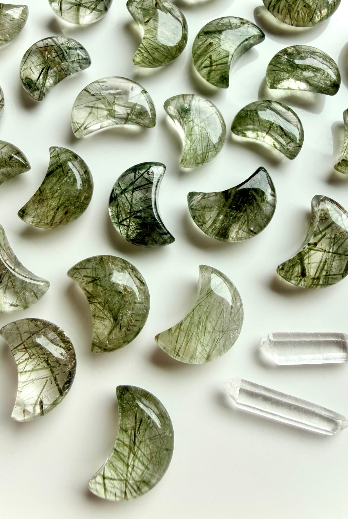 Tourmalinated Quartz moon crystals with green tourmaline inclusions arranged with Clear Quartz points