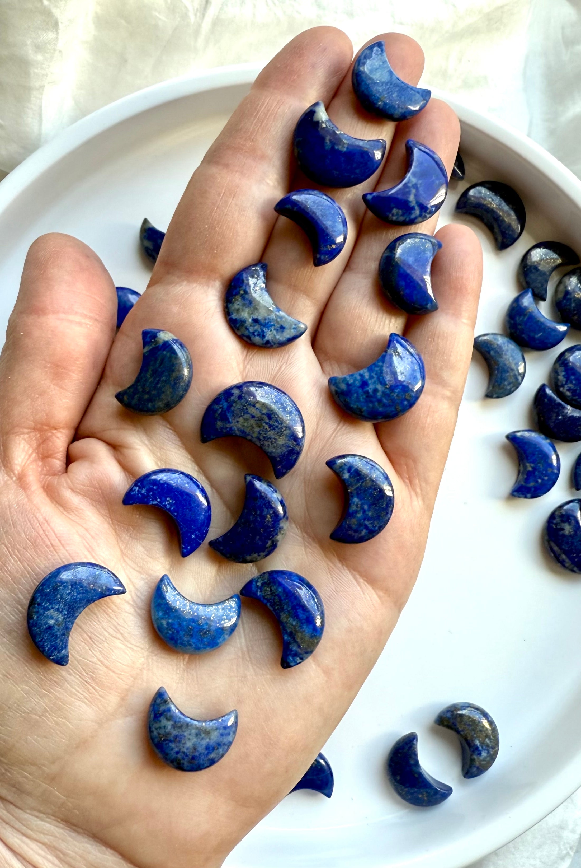Hand-carved Lapis Lazuli moon – deep blue with golden flecks